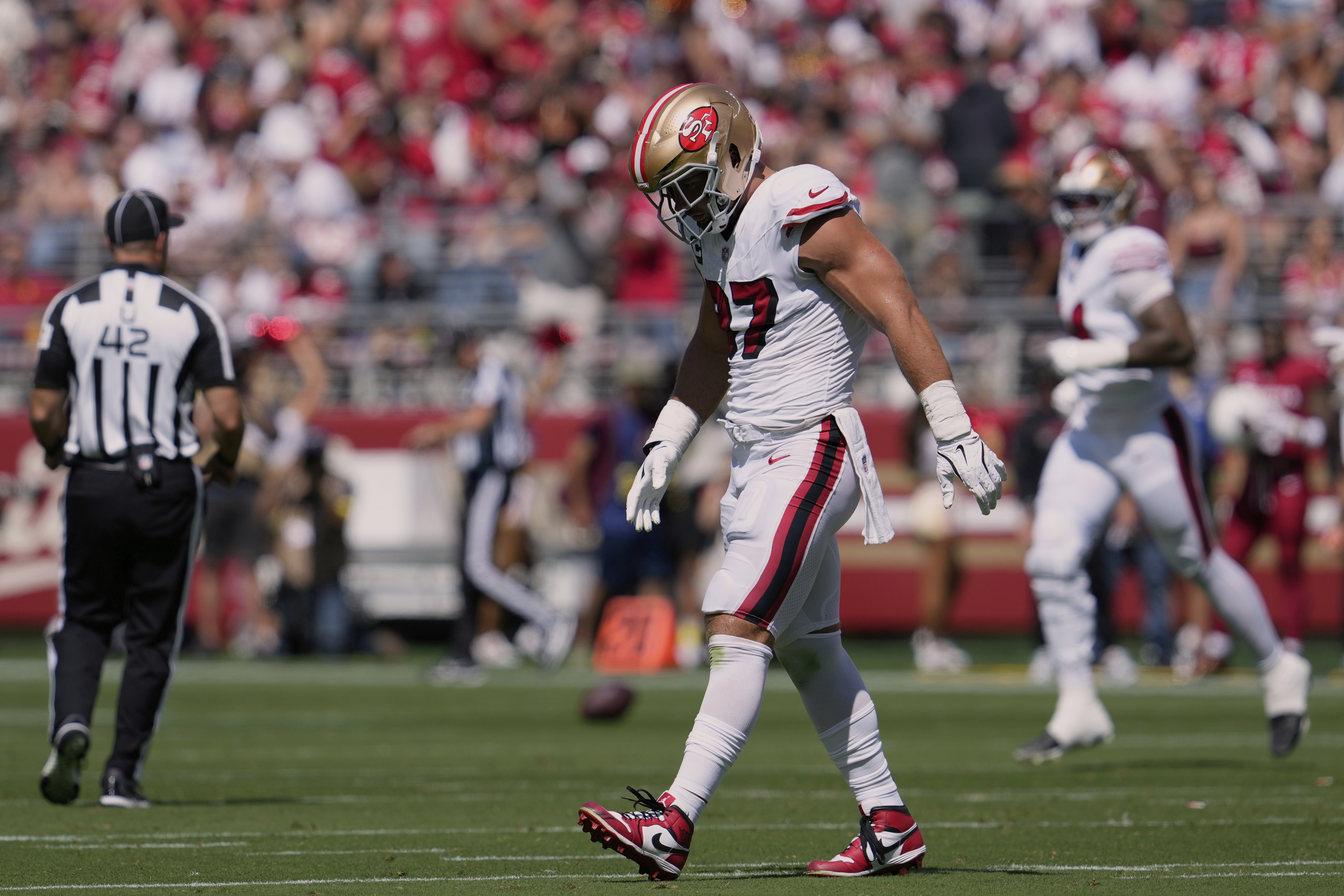 San Francisco 49ers defensive end Nick Bosa walks off the field during the first half of an NFL football game against the Arizona Cardinals, Sunday, Sept. 21, 2025, in Santa Clara, Calif. 
