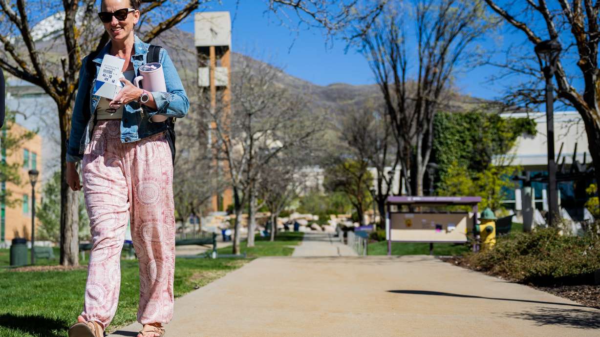 Student Camie Emery walks on campus at Weber State University in Ogden on April 14. Compared to the 49 other states and the District of Columbia, the Beehive State is ranked 50th in the study's "States With the Most Student Debt" list.