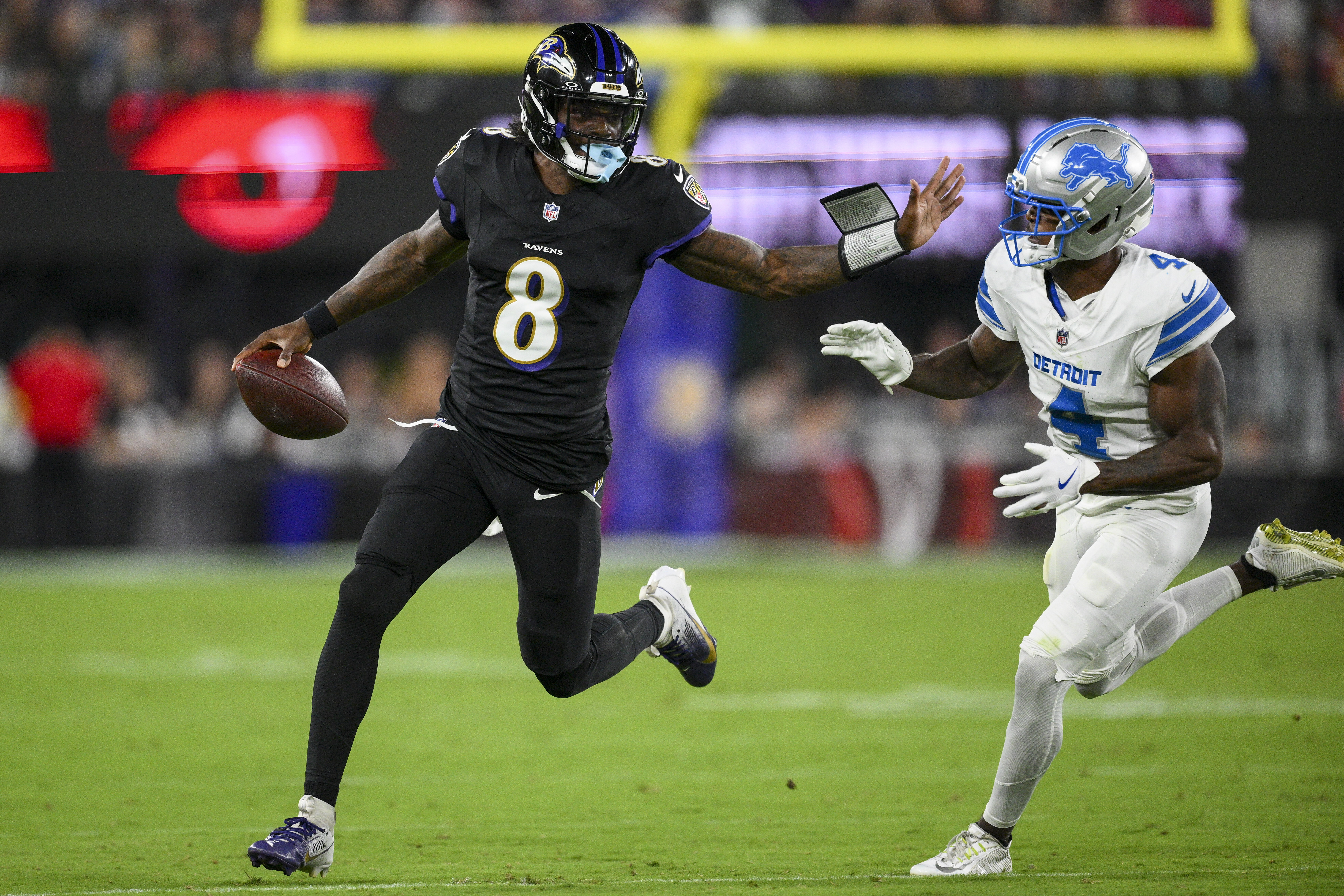 Baltimore Ravens quarterback Lamar Jackson (8) runs the ball as Detroit Lions cornerback DJ. Reed (4) tries to stop him during the first half of an NFL football game Monday, Sept. 22, 2025, in Baltimore.