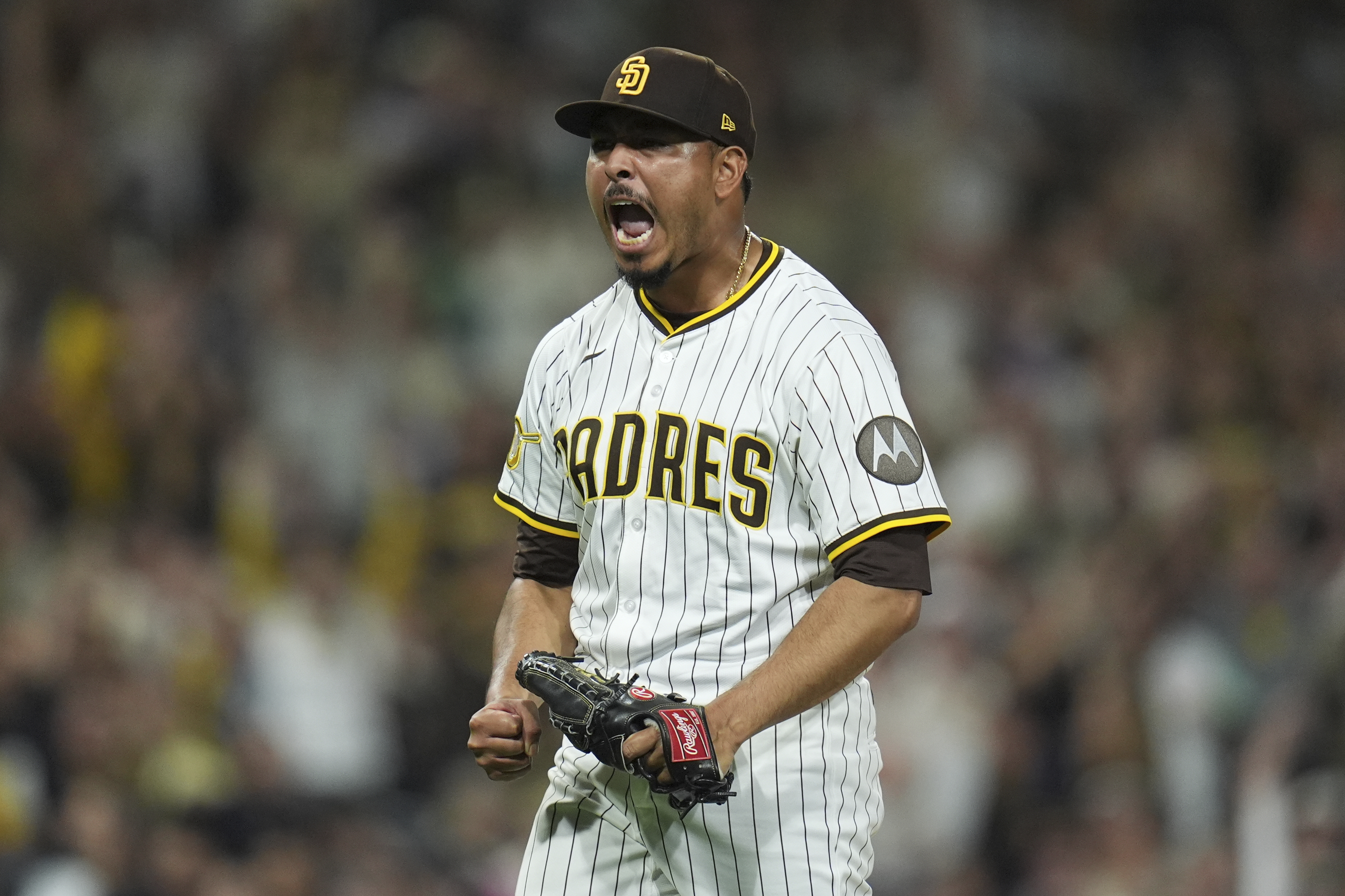 San Diego Padres relief pitcher Jeremiah Estrada celebrates after the third out during the eighth inning of a baseball game against the Milwaukee Brewers Monday, Sept. 22, 2025, in San Diego. 
