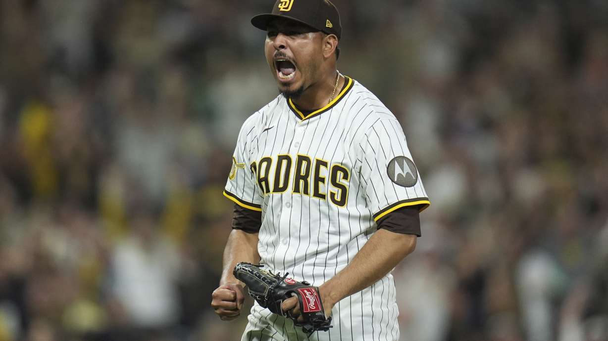 San Diego Padres relief pitcher Jeremiah Estrada celebrates after the third out during the eighth inning of a baseball game against the Milwaukee Brewers Monday, Sept. 22, 2025, in San Diego.