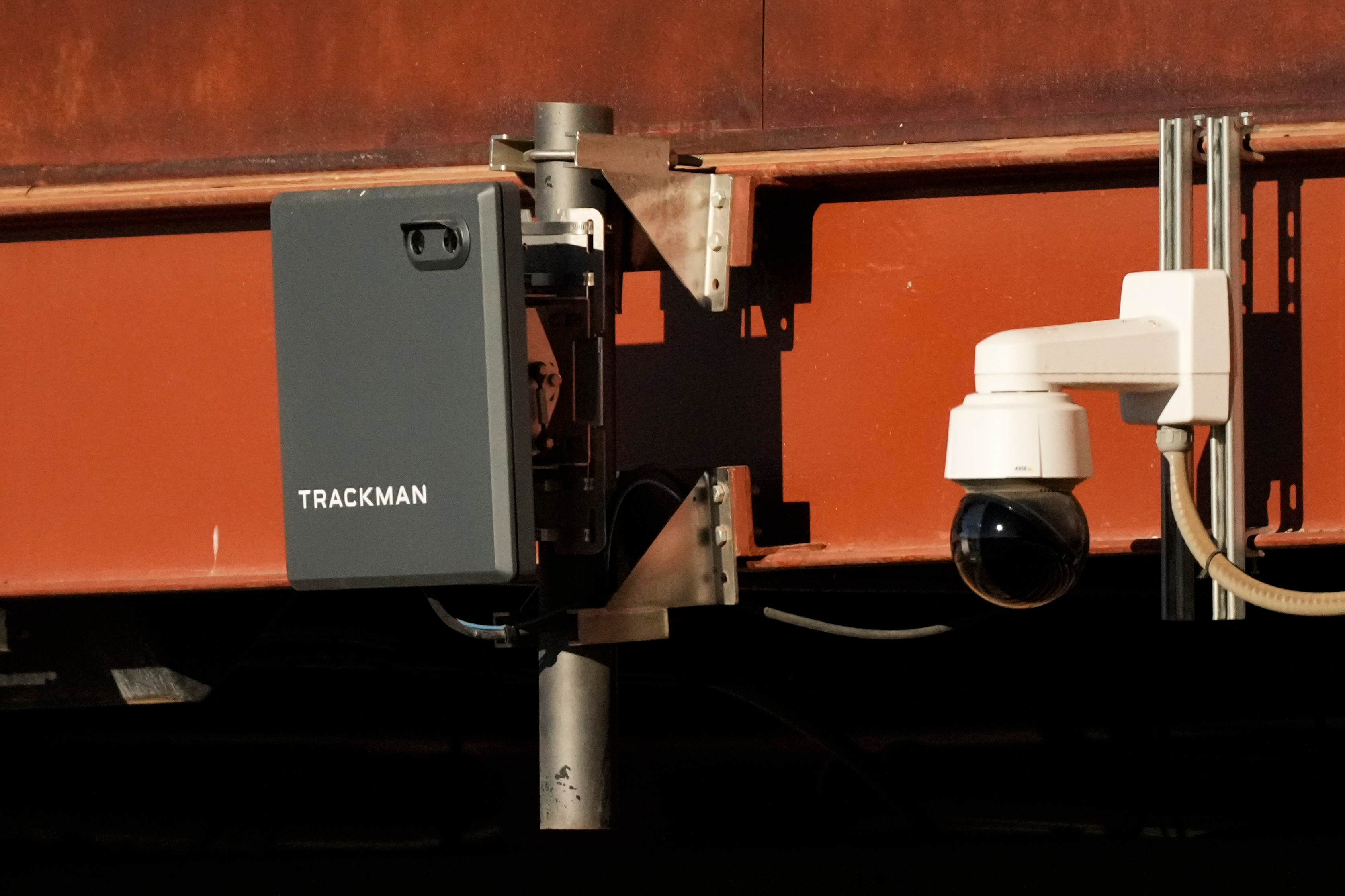 FILE - A Trackman device used for the Automated Ball-Strike System is posted on the balcony behind home plate before a spring training baseball game between the Kansas City Royals and the Los Angeles Dodgers, Saturday, Feb. 22, 2025, in Phoenix.