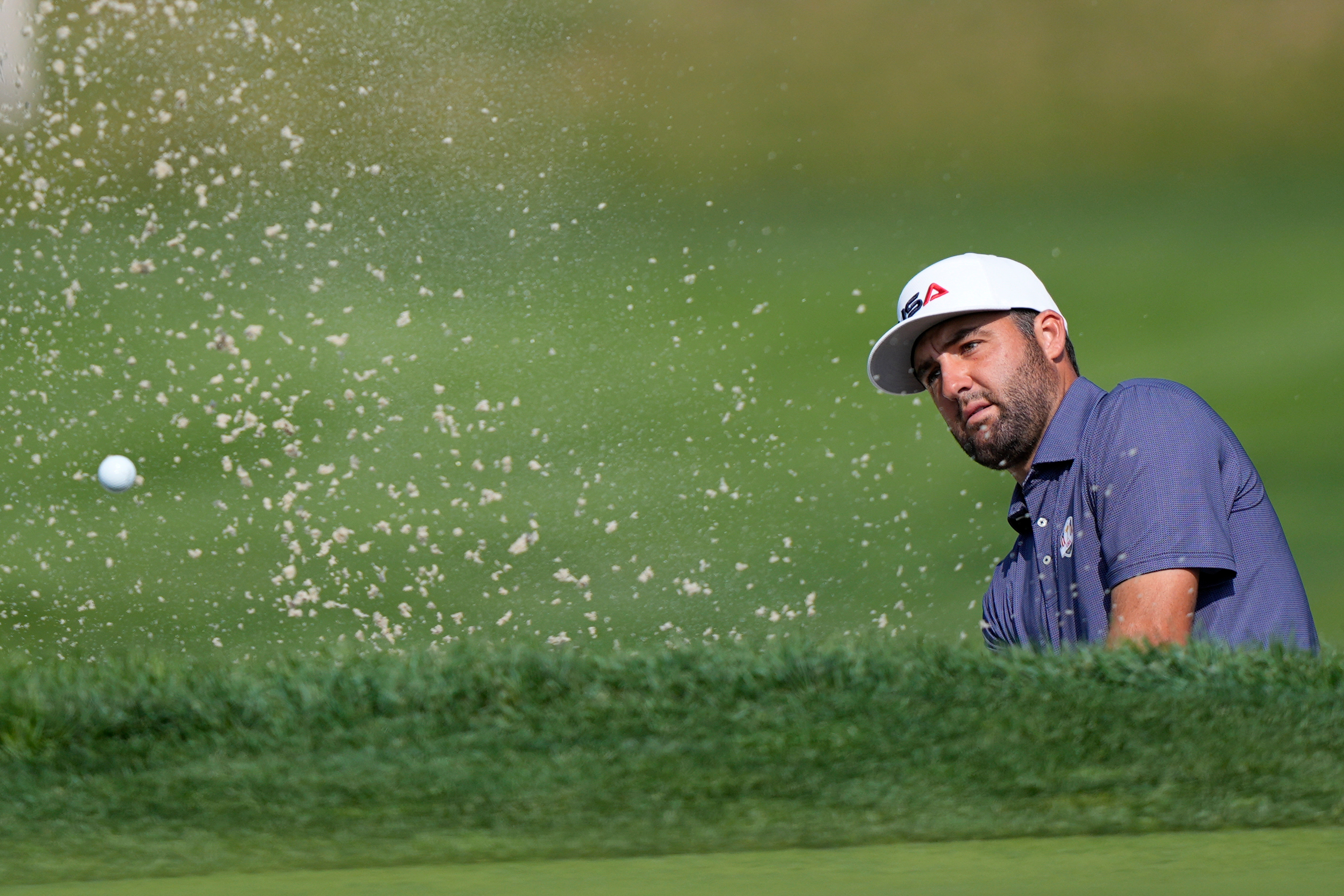 United States' Scottie Scheffler hits from the bunker on the 11th hole during a practice round for the Ryder Cup golf tournament, Tuesday, Sept. 23, 2025, in Farmingdale, N.Y., at Bethpage State Park's Black Course. 