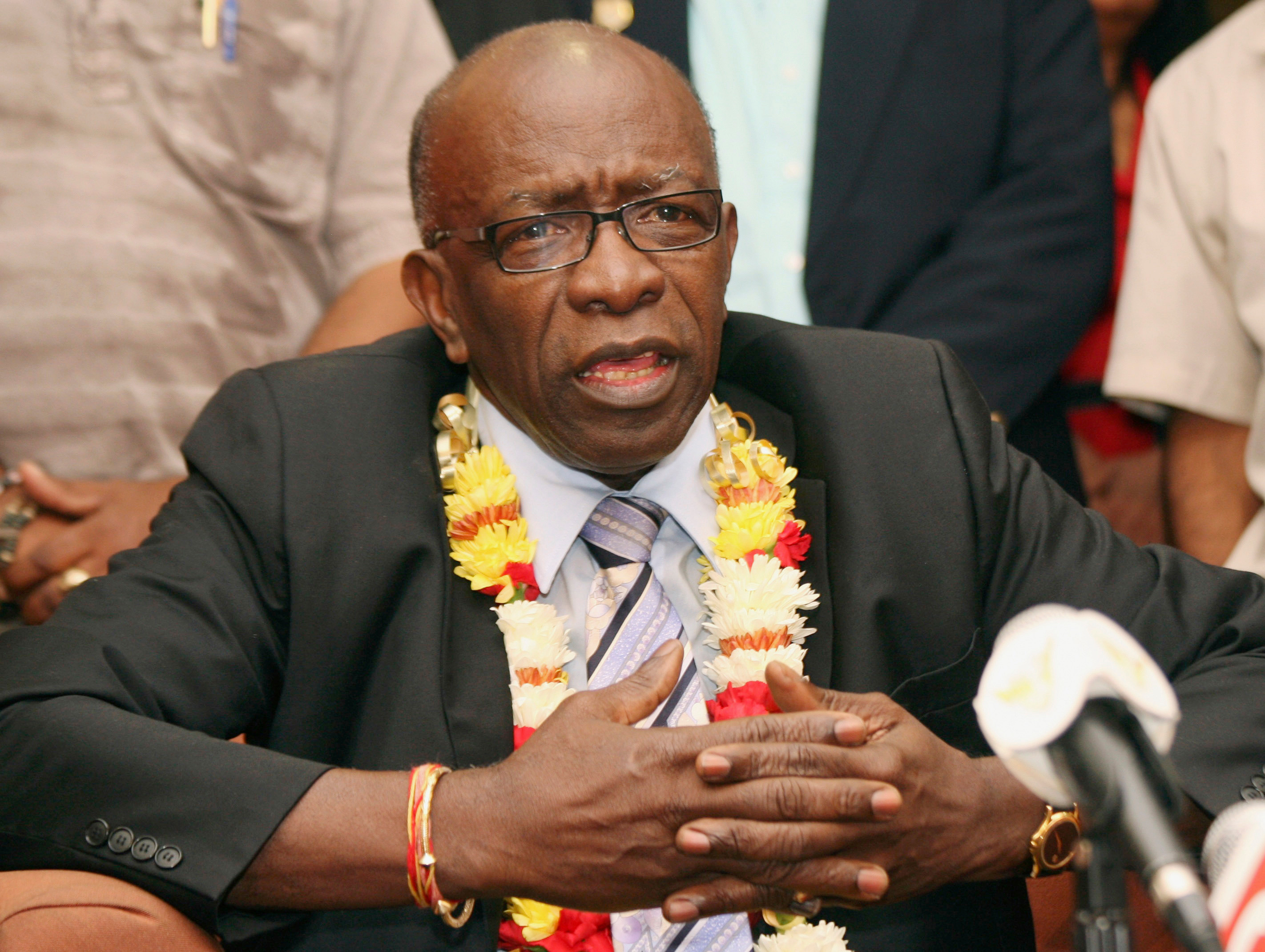 FILE - Suspended FIFA executive Jack Warner gestures during a news conference at the airport in Port-of-Spain, Trinidad and Tobago, June 2, 2011. 