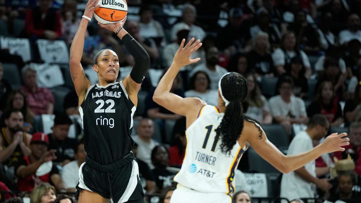 Las Vegas Aces center A'ja Wilson (22) shoots over Indiana Fever forward Brianna Turner (11) during the first half of Game 2 of a WNBA basketball playoff semifinals series Tuesday, Sept. 23, 2025, in Las Vegas.