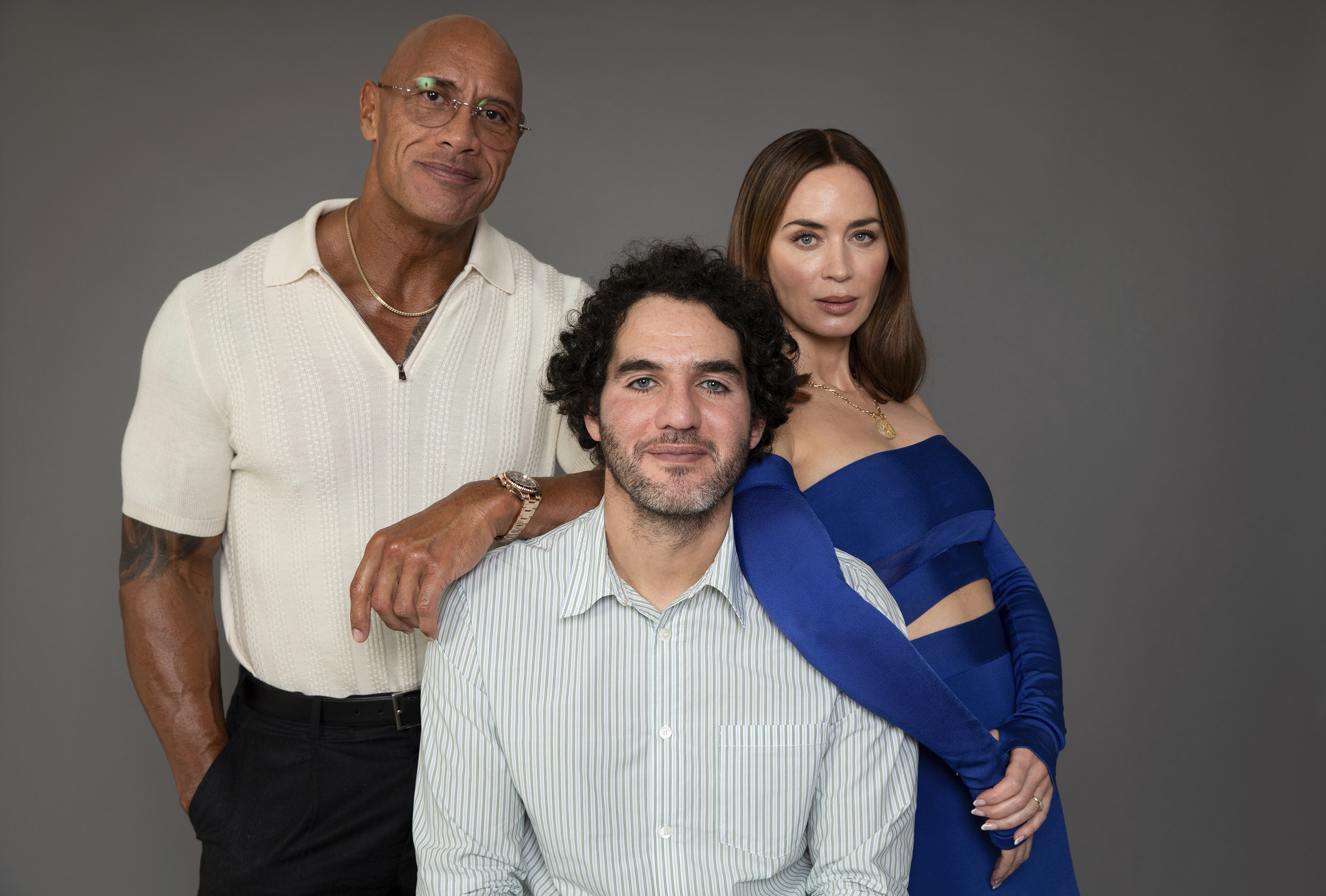 Dwayne Johnson, from left, Benny Safdie and Emily Blunt pose to promote their film "The Smashing Machine" on Friday, Sept. 12, 2025, in Los Angeles. 
