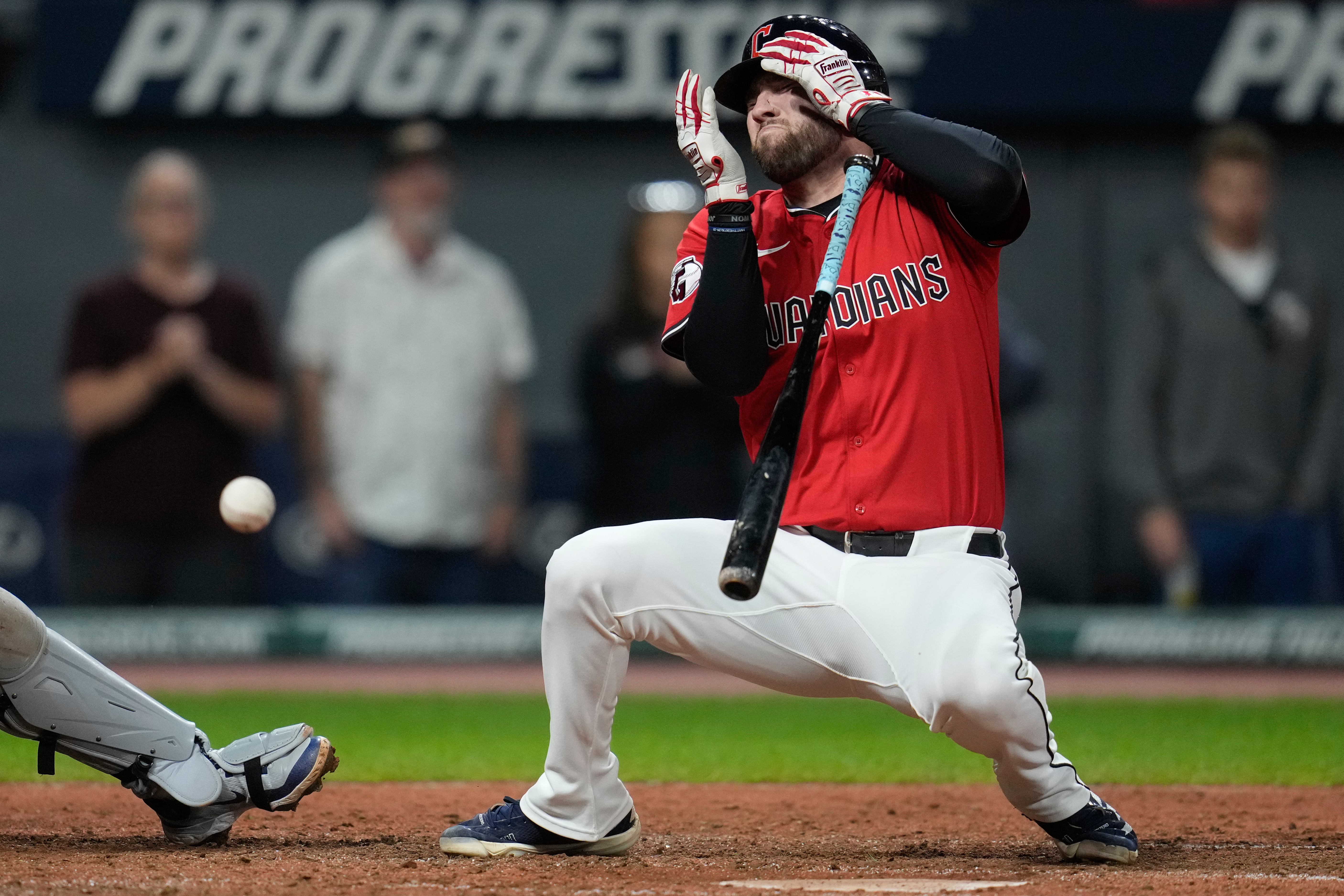 CORRECTION CORRECTS HITTING ON THE FACE BY PITCH - Cleveland Guardians' David Fry falls back after being hit in the face by a pitch in the sixth inning of a baseball game against the Detroit Tigers in Cleveland, Tuesday, Sept. 23, 2025. 