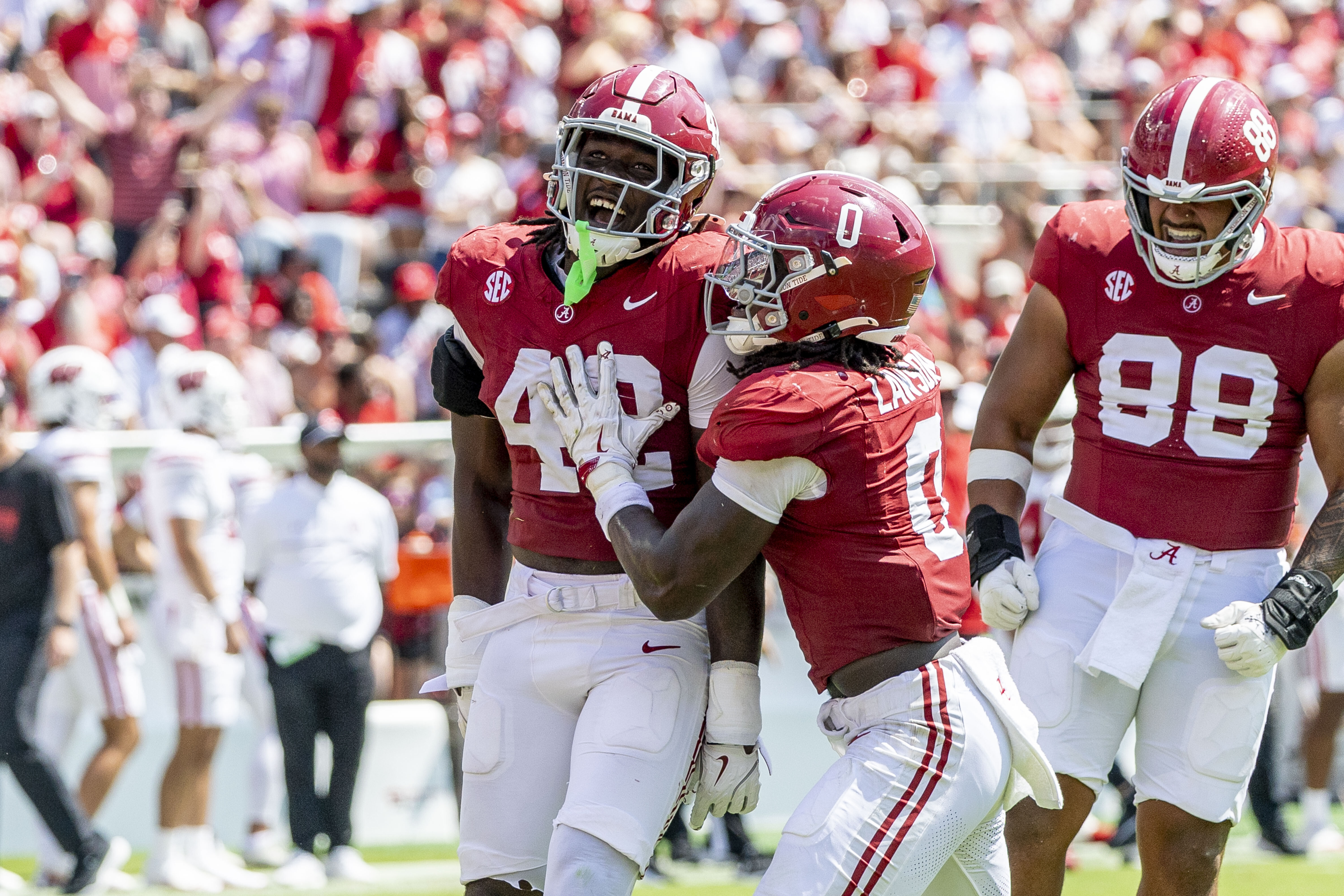 Alabama linebacker Yhonzae Pierre (42) celebrates a sack with Alabama linebacker Deontae Lawson (0) during the second half of an NCAA college football game against Wisconsin, Saturday, Sept. 13, 2025, in Tuscaloosa, Ala. 
