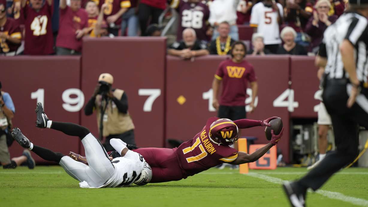 Washington Commanders wide receiver Terry McLaurin (17) is brought down by Las Vegas Raiders cornerback Kyu Blu Kelly (36) during the second half of NFL football game Sunday, Sept. 21, 2025, in Landover, Md.