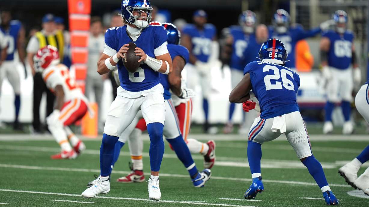 FILE - New York Giants quarterback Jaxson Dart drops back to pass during the second half of an NFL football game against the Kansas City Chiefs Sunday, Sept. 21, 2025, in East Rutherford, N.J.