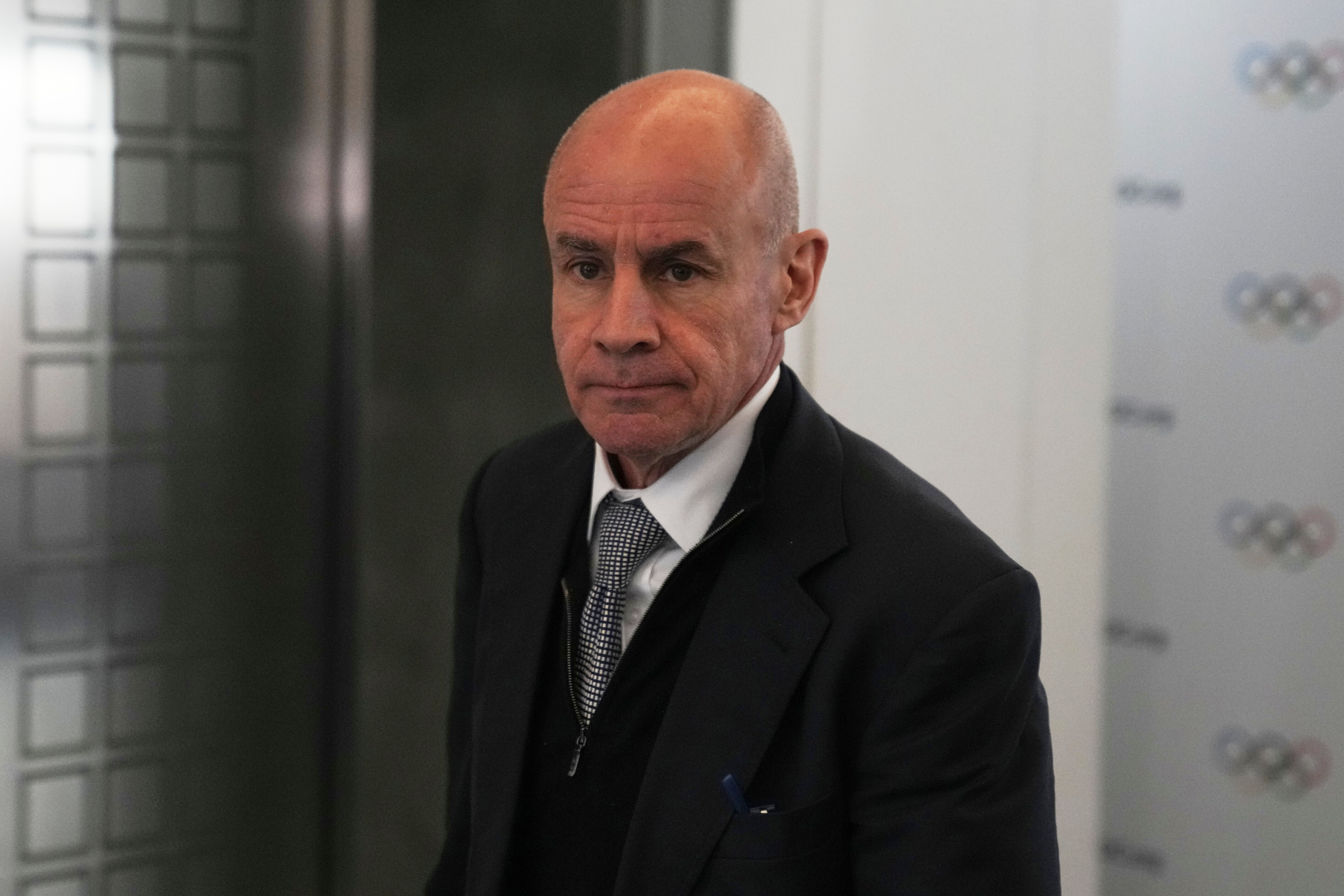 FILE - Candidate to the presidency of the International Olympic Committee Johan Eliasch arrives at the mixed zone during a break of the 144th session, which will elect the new IOC President, in Costa Navarino, western Greece, March 19, 2025.