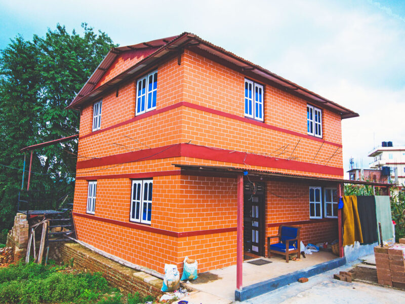 A home constructed from Build up Nepal's eco-friendly bricks is pictured. Build up Nepal, a nonprofit organization that replaces coal-fired bricks with eco-friendly ones to make safe housing affordable for poor communities, was chosen as the winner of the University of Utah's $250,000 Wilkes Climate Launch Prize for 2025.