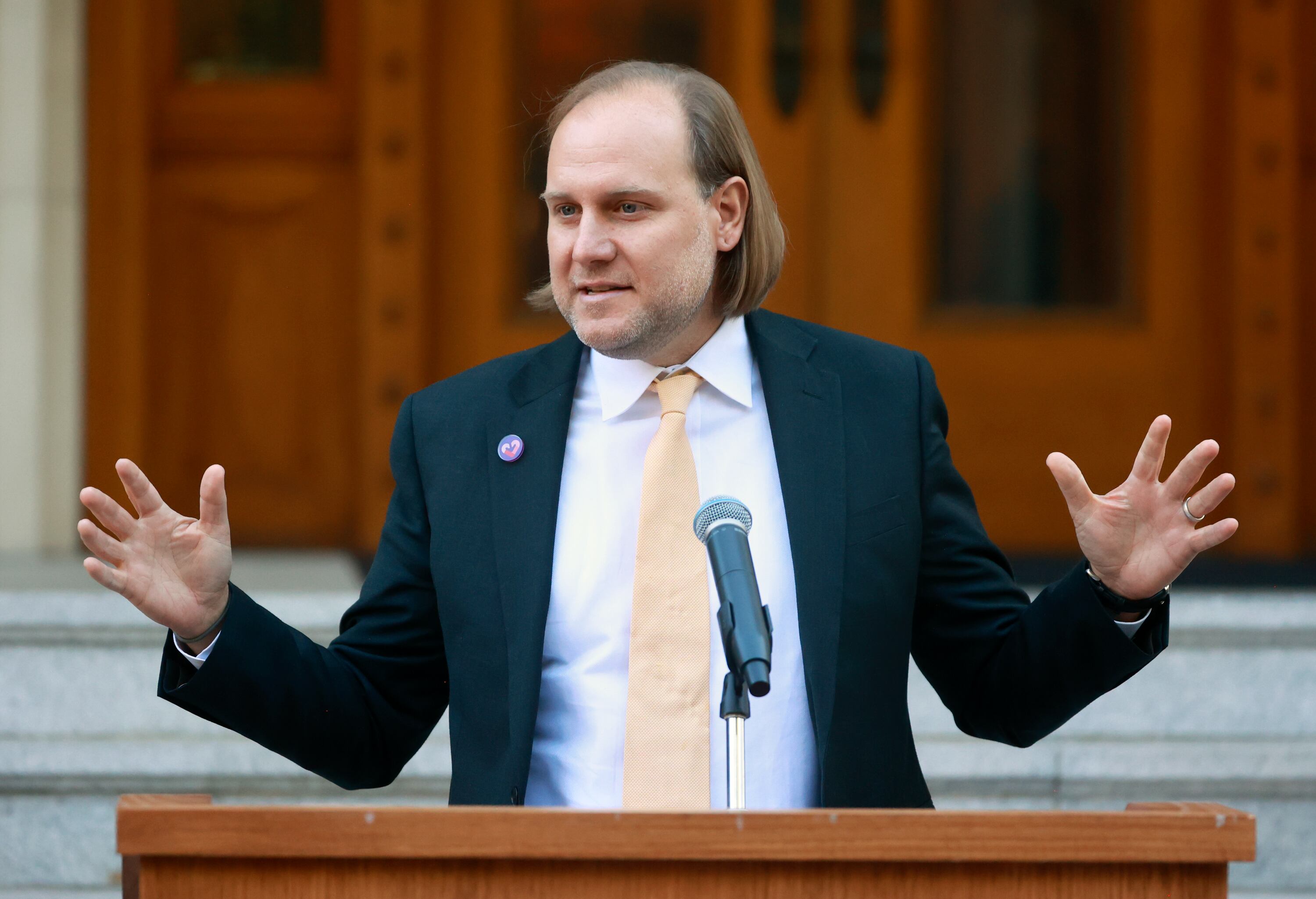 The Rev. Nathan Sautter speaks during the launch of Care Communities at the Governor’s Mansion in Salt Lake City on Wednesday. Sautter is also an adoptive foster parent.