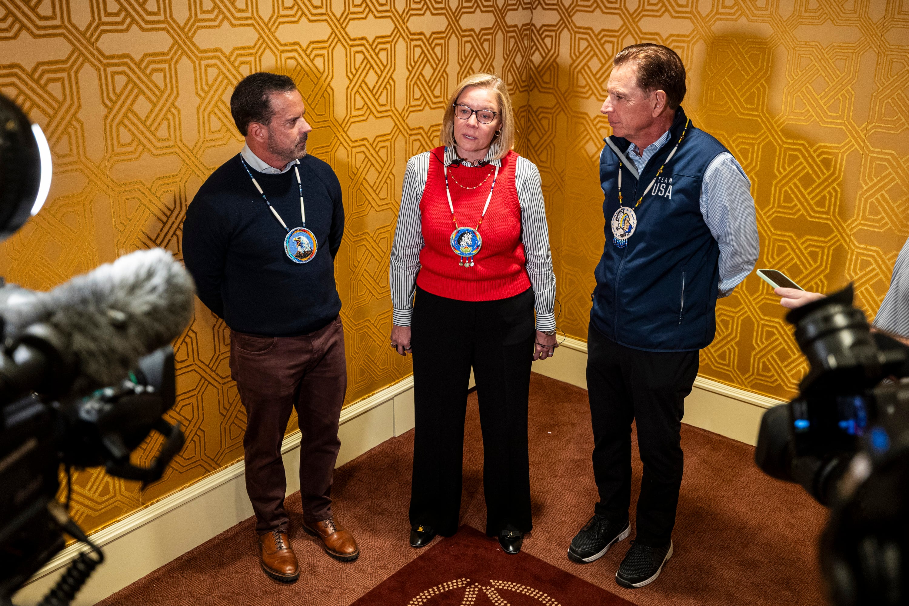 Sarah Hirshland, center, CEO of the U.S. Olympic Committee, speaks as she’s joined by Vice Chair and CEO Brad Wilson, left, and Executive Chair and President Fraser Bullock, right, during media availability after a quarterly meeting of the steering committee for the Organizing Committee for the 2034 Olympic and Paralympic Winter Games held at The Little America Hotel in Salt Lake City on Wednesday.
