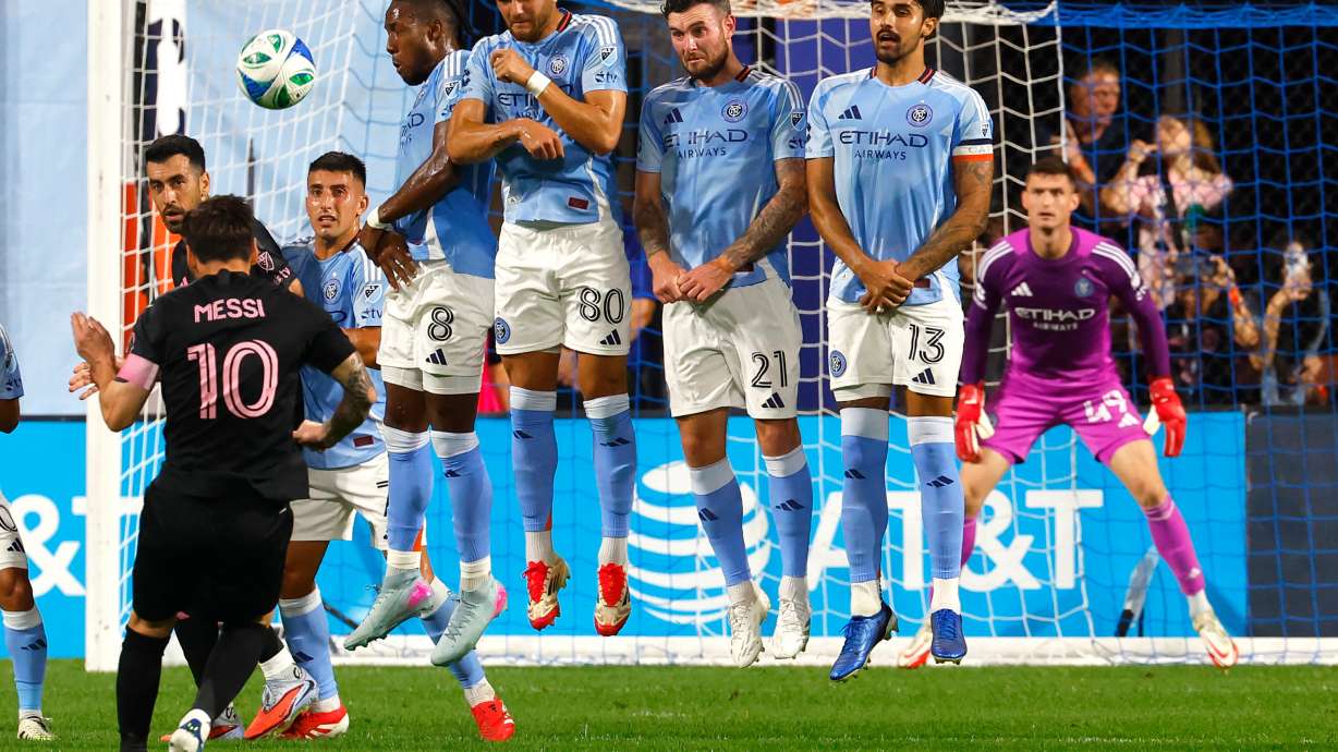 New York City FC defend a direct kick by Inter Miami forward Lionel Messi (10) during the first half of a MLS soccer game, Wednesday, Sept. 24, 2025, in New York.