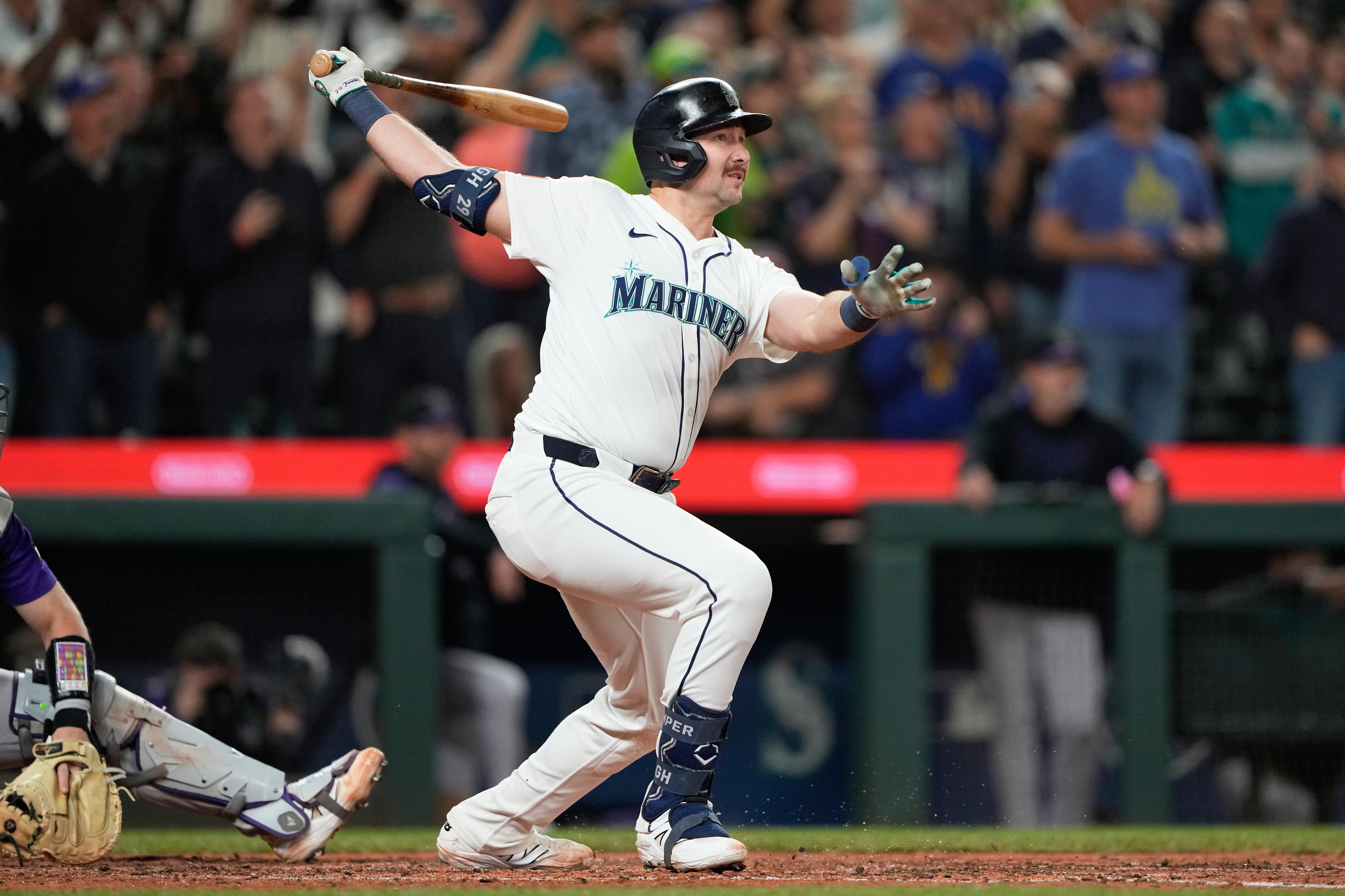 Seattle Mariners' Cal Raleigh watches his 60th home run during the eighth inning of a baseball game against the Colorado Rockies, Wednesday, Sept. 24, 2025, in Seattle. 