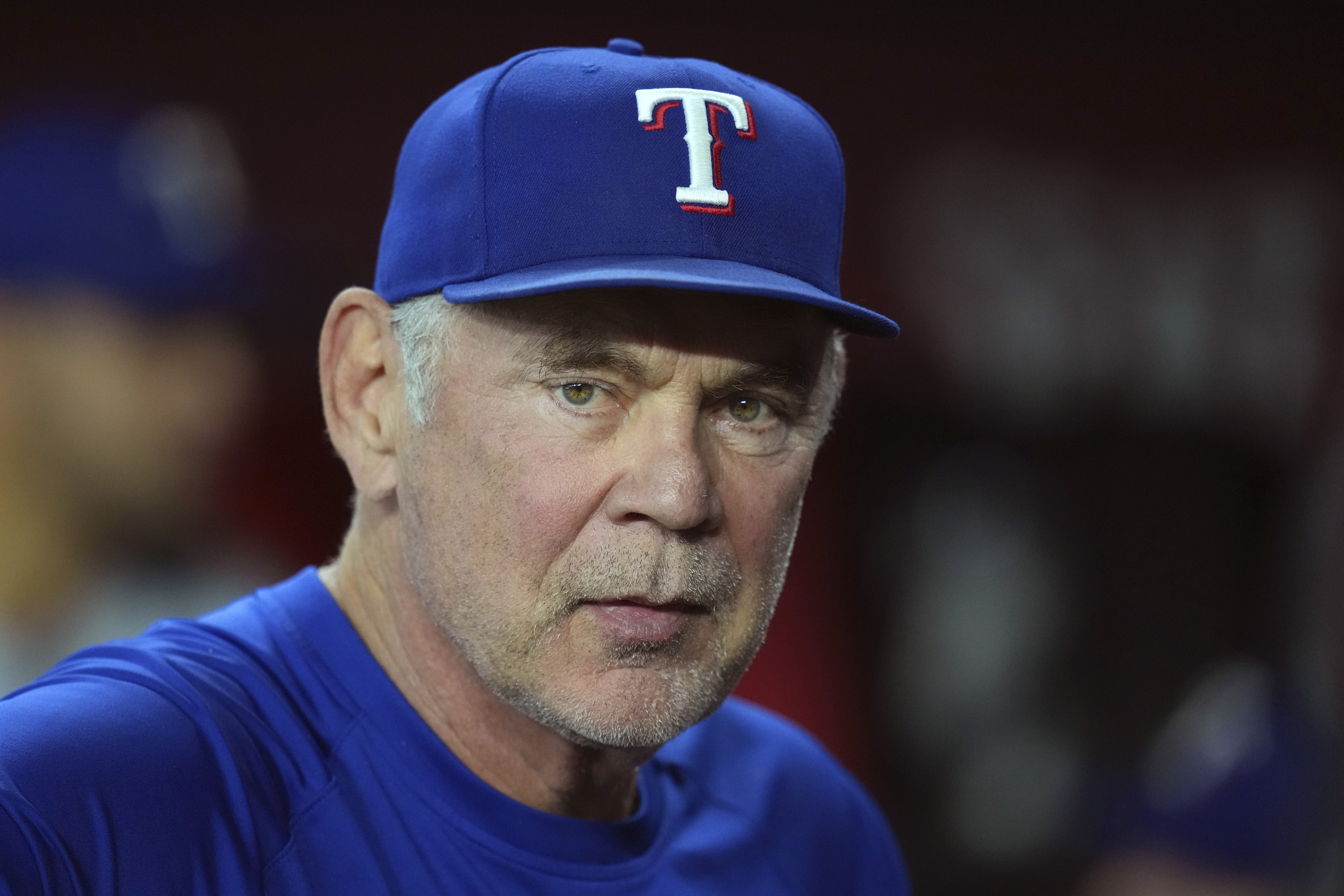 Texas Rangers manager Bruce Bochy pauses in the team dugout prior to a baseball game against the Arizona Diamondbacks Wednesday, Sept. 3, 2025, in Phoenix. 