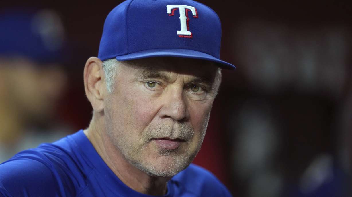 Texas Rangers manager Bruce Bochy pauses in the team dugout prior to a baseball game against the Arizona Diamondbacks Wednesday, Sept. 3, 2025, in Phoenix.