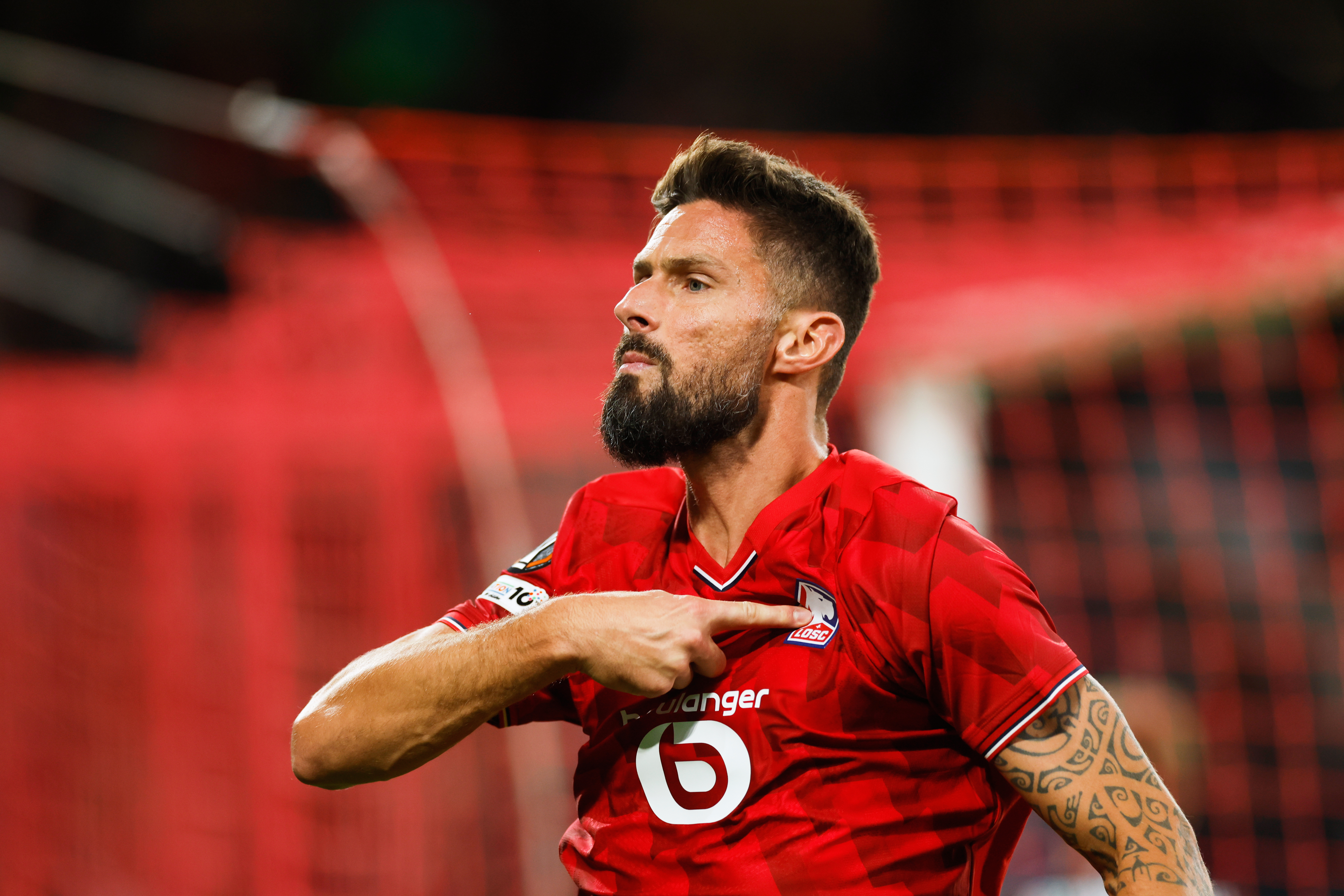Lille's Olivier Giroud celebrates after scoring his sides second goal during the Europa League soccer match between Lille and Brann at the Pierre Mauroy stadium in Villeneuve d'Ascq, northern France, Thursday, Sept. 25, 2025. 