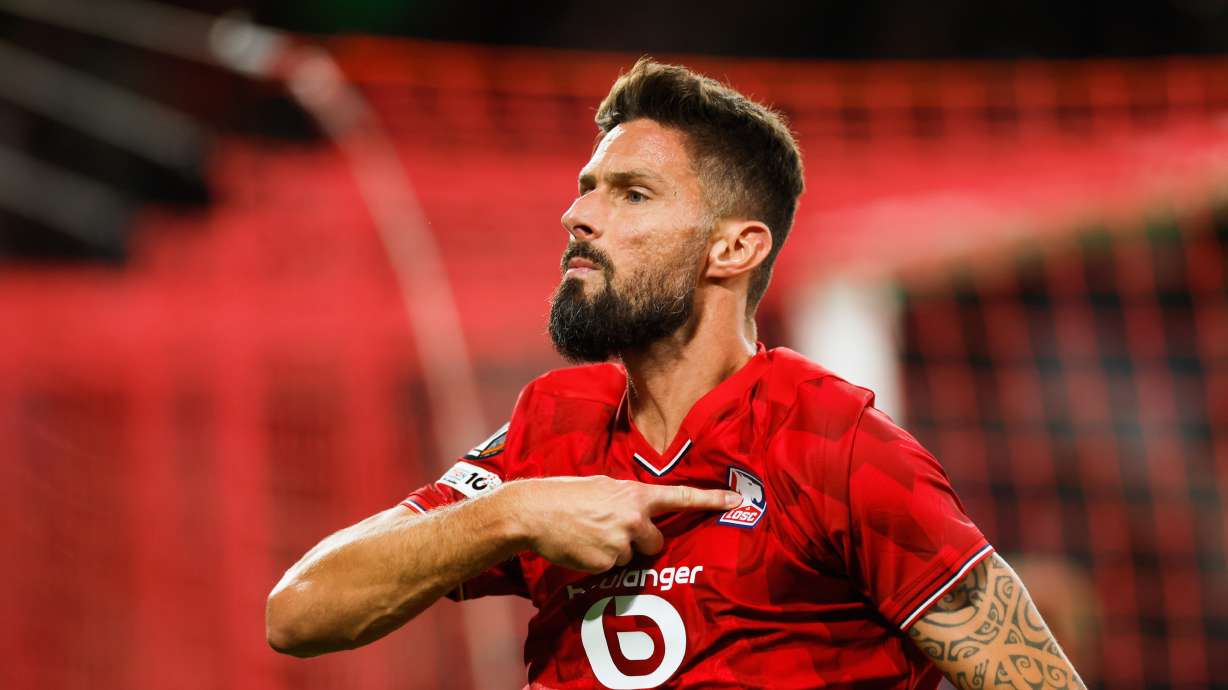 Lille's Olivier Giroud celebrates after scoring his sides second goal during the Europa League soccer match between Lille and Brann at the Pierre Mauroy stadium in Villeneuve d'Ascq, northern France, Thursday, Sept. 25, 2025.