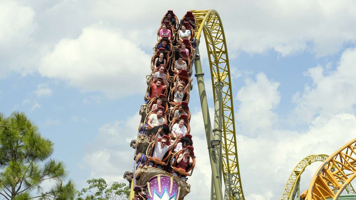 Guests ride on Stardust Racers at Universal Resort Orlando, April 10. A woman sued the resort on Friday, claiming she was injured on a roller coaster at its newest theme park.