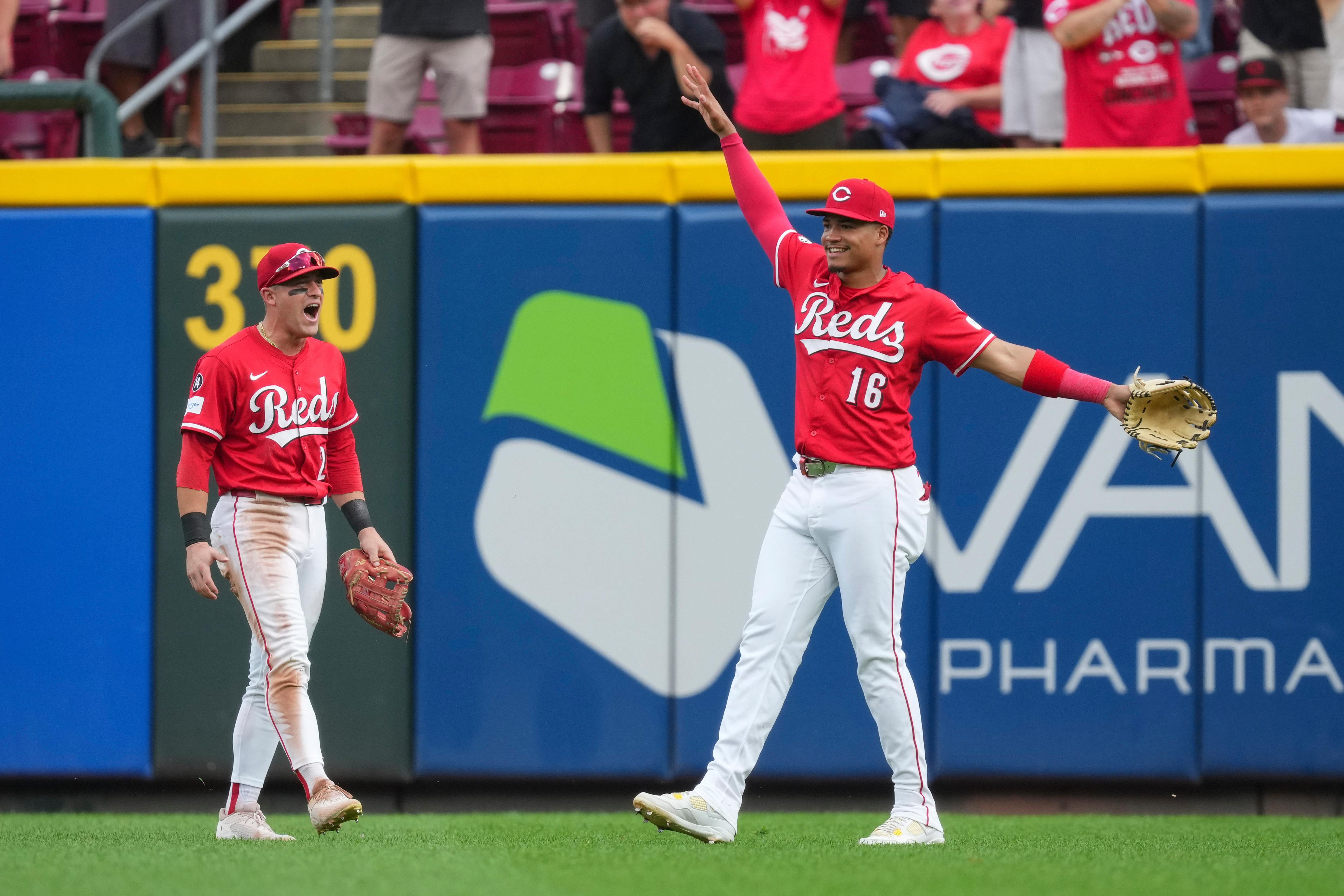 Cincinnati Reds outfielder Noelvi Marte (16) celebrates with teammate TJ Friedl (29) after catching a fly ball hit by Pittsburgh Pirates' Bryan Reynolds during the ninth inning of a baseball game, Thursday, Sept. 25, 2025, in Cincinnati. 