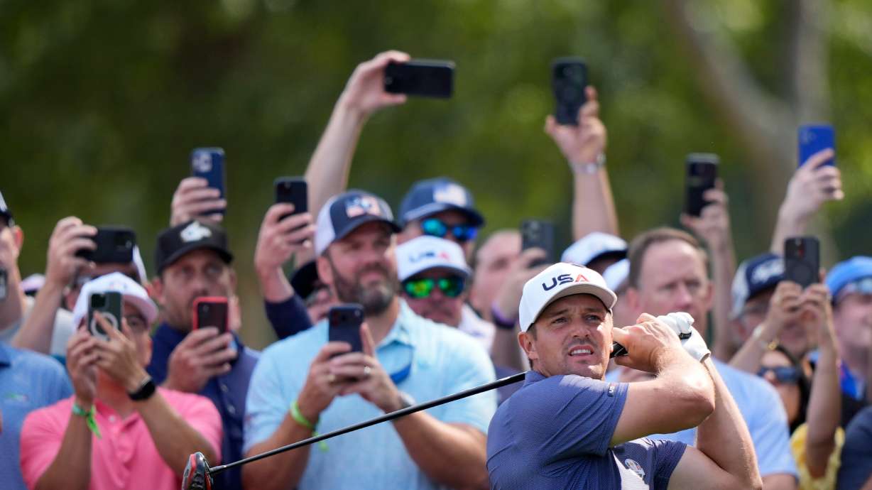 United States' Bryson DeChambeau watches his tee shot on the 12th hole during a practice round for the Ryder Cup golf tournament, Tuesday, Sept. 23, 2025, in Farmingdale, N.Y., at Bethpage State Park's Black Course.