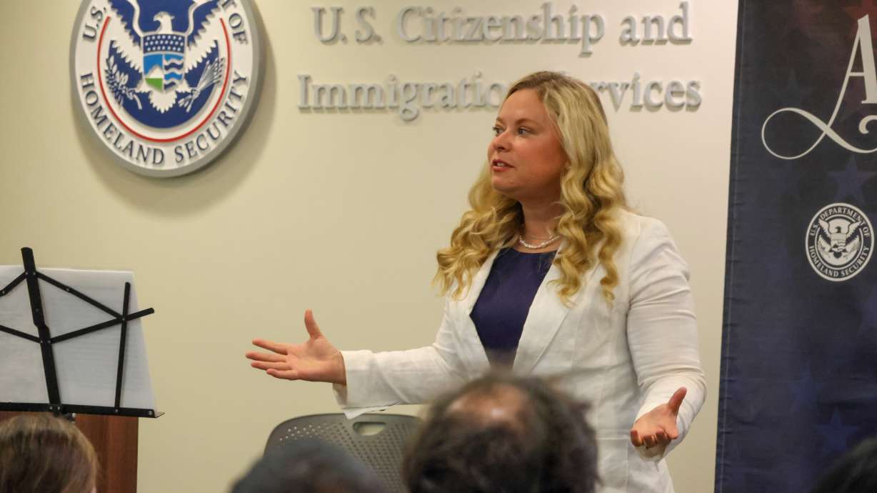 Salt Lake County Clerk Lannie Chapman said her office will bolster its efforts to register new citizens to vote after a federal policy shift. She's pictured at a West Valley City naturalization ceremony on Sept. 8.