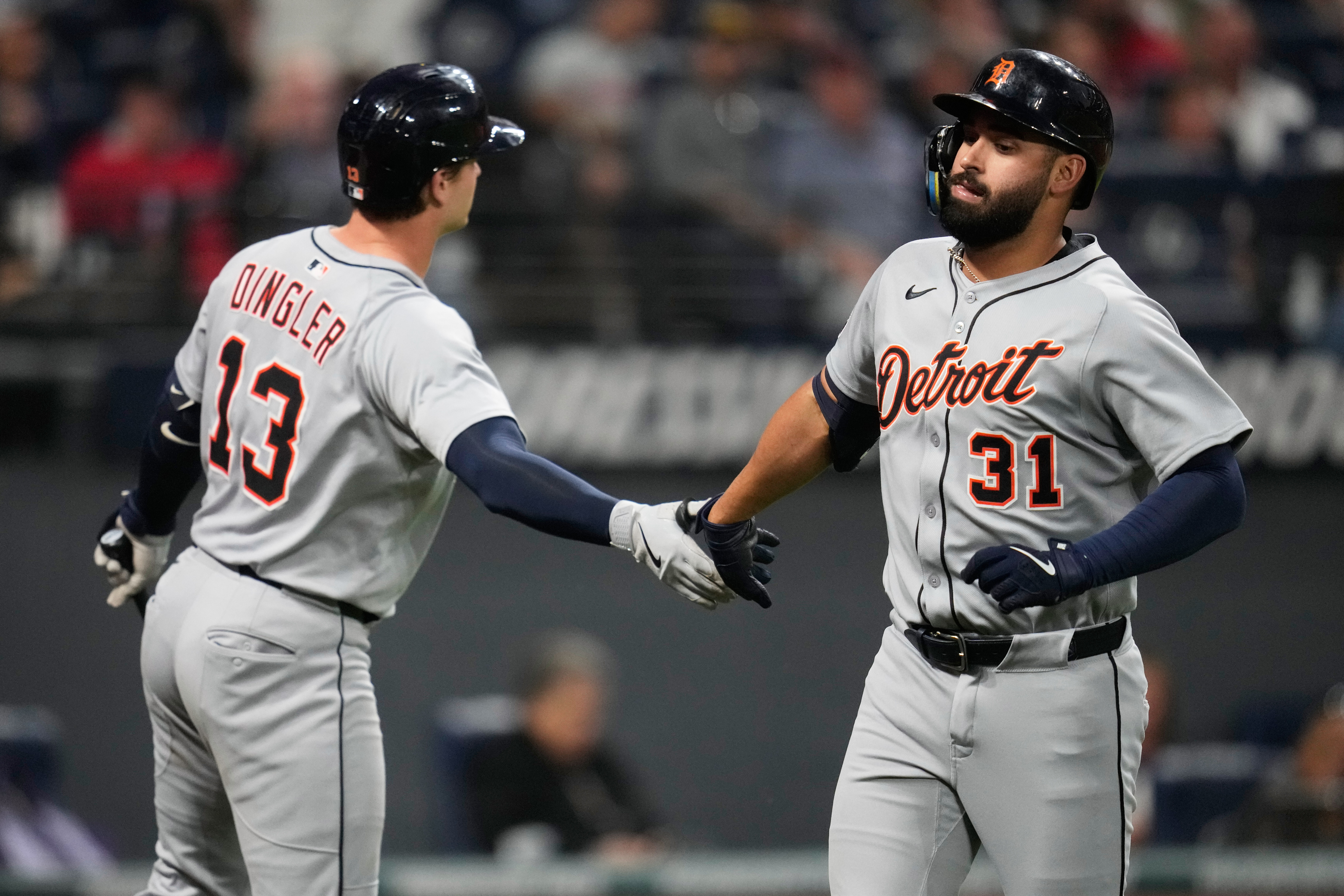 Detroit Tigers' Riley Greene (31) is congratulated by Dillon Dingler (13) after hitting a home run in the fourth inning of a baseball game against the Cleveland Guardians in Cleveland, Thursday, Sept. 25, 2025. 
