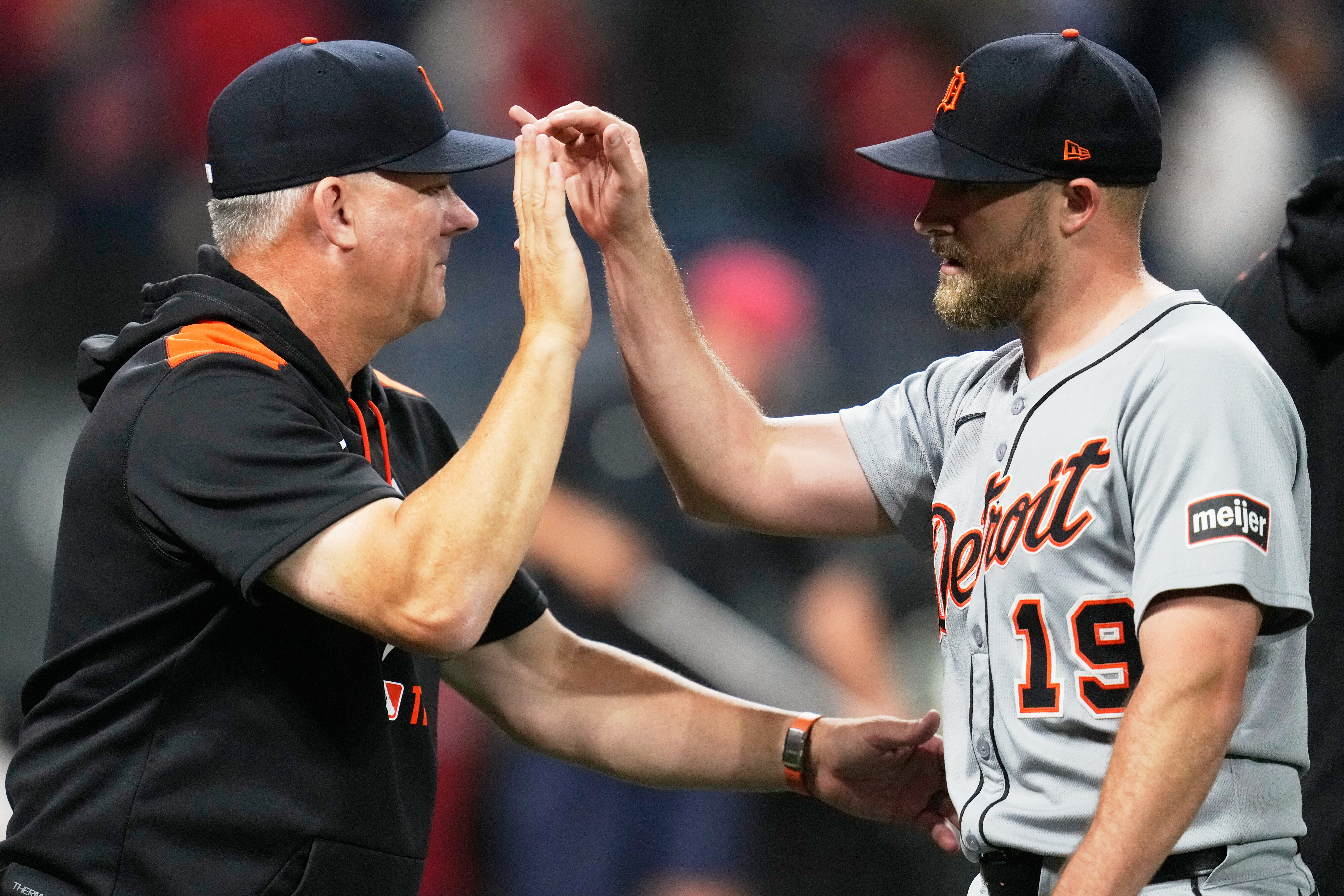 Detroit Tigers manager A.J. Hinch, left, greets relief pitcher Will Vest (19) after the Tigers defeated the Cleveland Guardians in a baseball game in Cleveland, Thursday, Sept. 25, 2025. 
