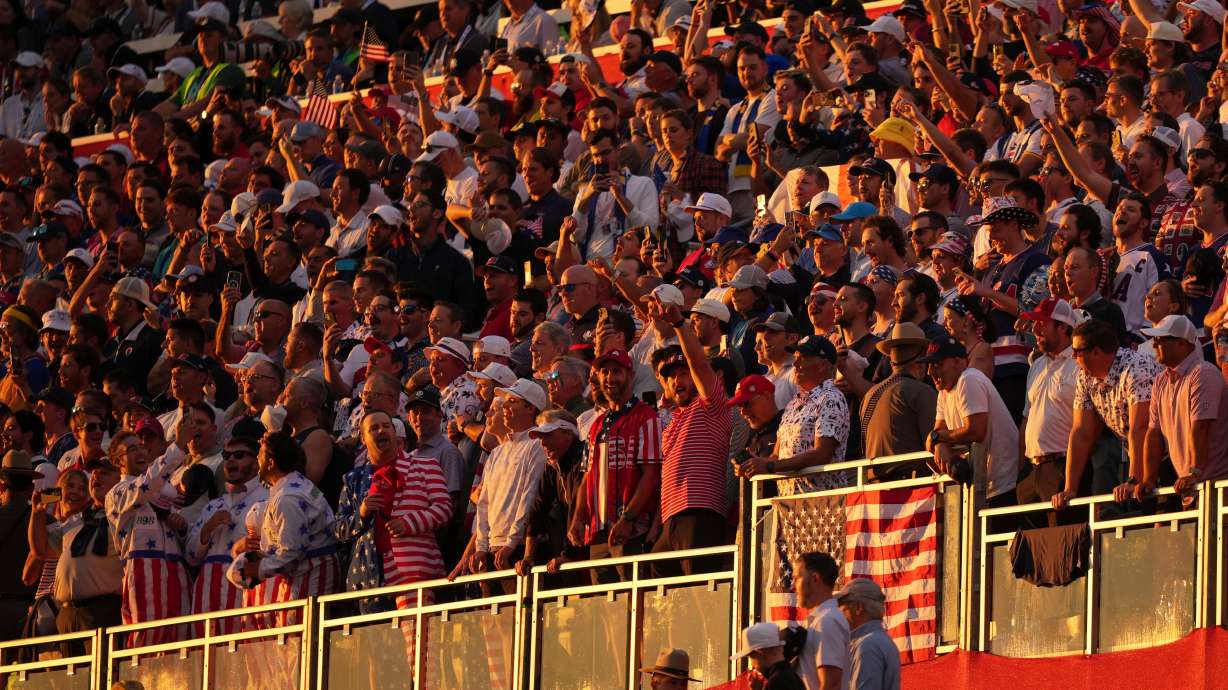 Fans wait for the start on the first hole at Bethpage Black golf course during the Ryder Cup golf tournament, Friday, Sept. 26, 2025, in Farmingdale, N.Y.