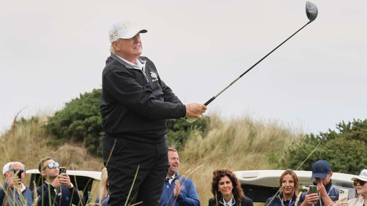 FILE - President Donald Trump tees off during the opening ceremony for the Trump International Golf Links golf course, near Aberdeen, Scotland, July 29, 2025.