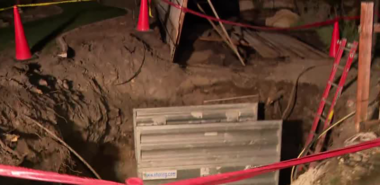 Damage is seen Thursday at a home in Sandy after a water main broke on Sunday.   The homeowners were still displaced on Thursday after the water damaged their home and yard.