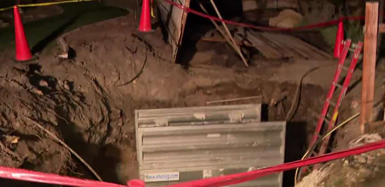 Damage is seen Thursday at a home in Sandy after a water main broke on Sunday. The homeowners were still displaced on Thursday after the water damaged their home and yard.