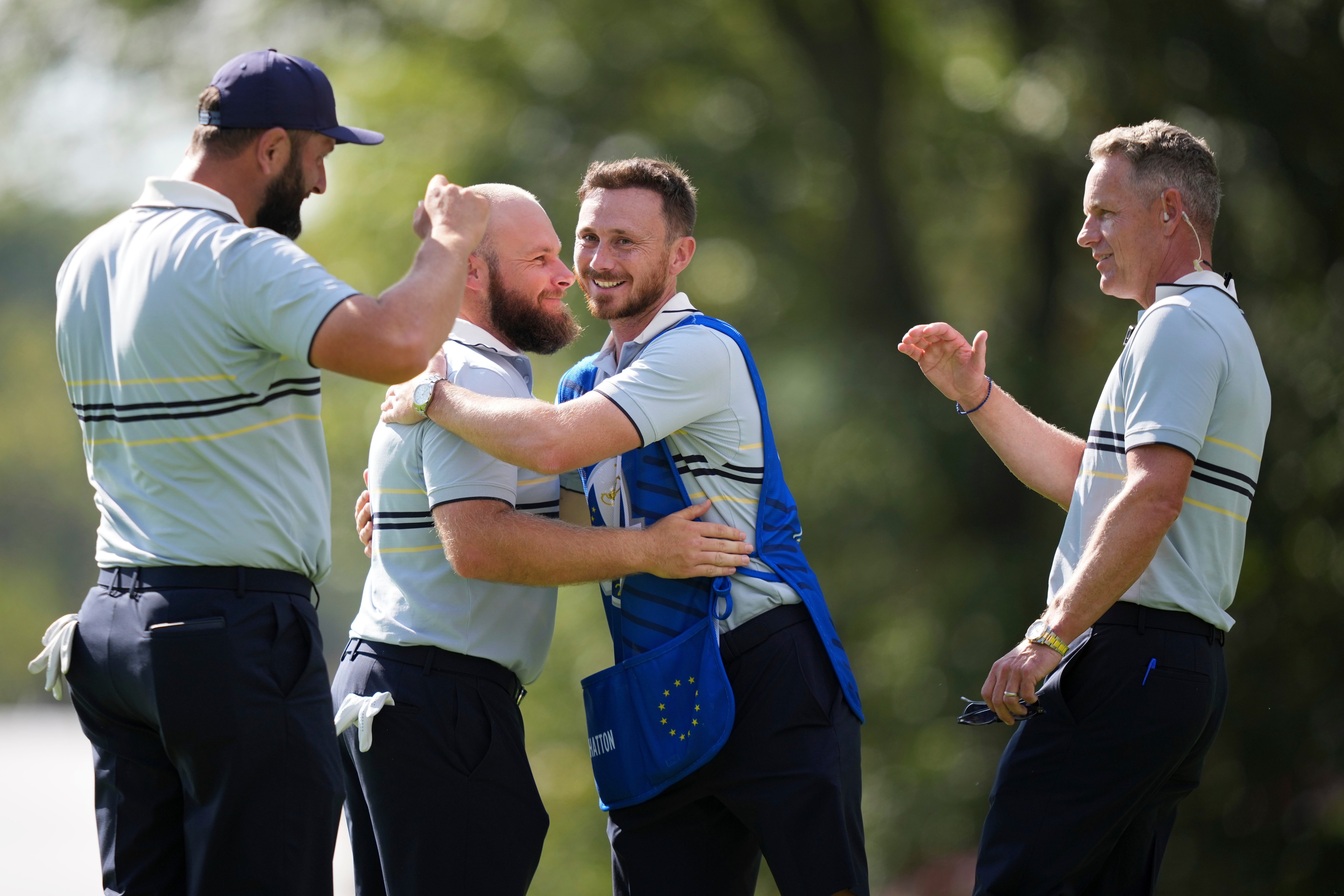 Europe's Jon Rahm, Tyrrell Hatton and captain Luke Donald celebrate after their win on the 15th hole at Bethpage Black golf course during the Ryder Cup golf tournament, Friday, Sept. 26, 2025, in Farmingdale, N.Y. 