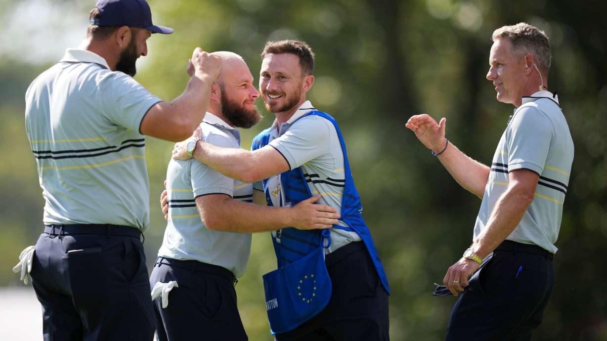 Europe's Jon Rahm, Tyrrell Hatton and captain Luke Donald celebrate after their win on the 15th hole at Bethpage Black golf course during the Ryder Cup golf tournament, Friday, Sept. 26, 2025, in Farmingdale, N.Y.