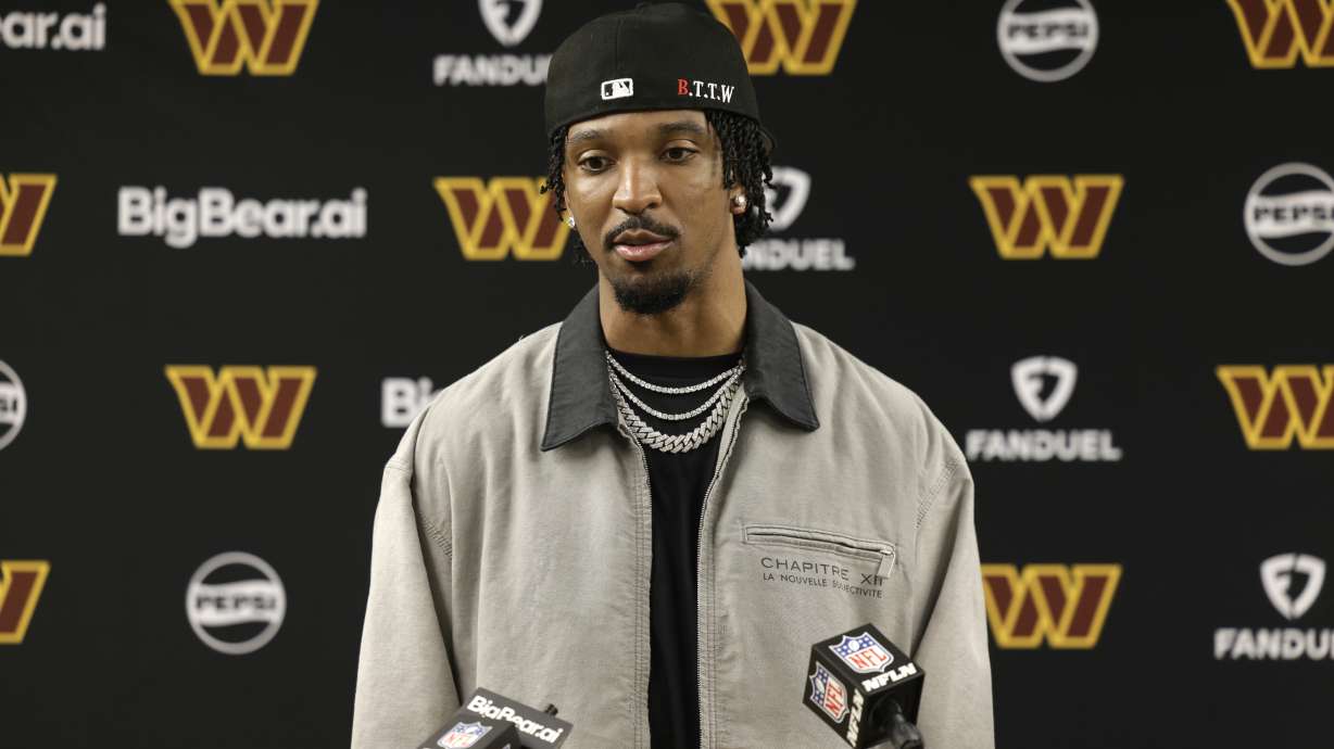Washington Commanders quarterback Jayden Daniels speaks during a news conference following an NFL football game against the Green Bay Packers Thursday, Sept. 11, 2025, in Green Bay, Wis.