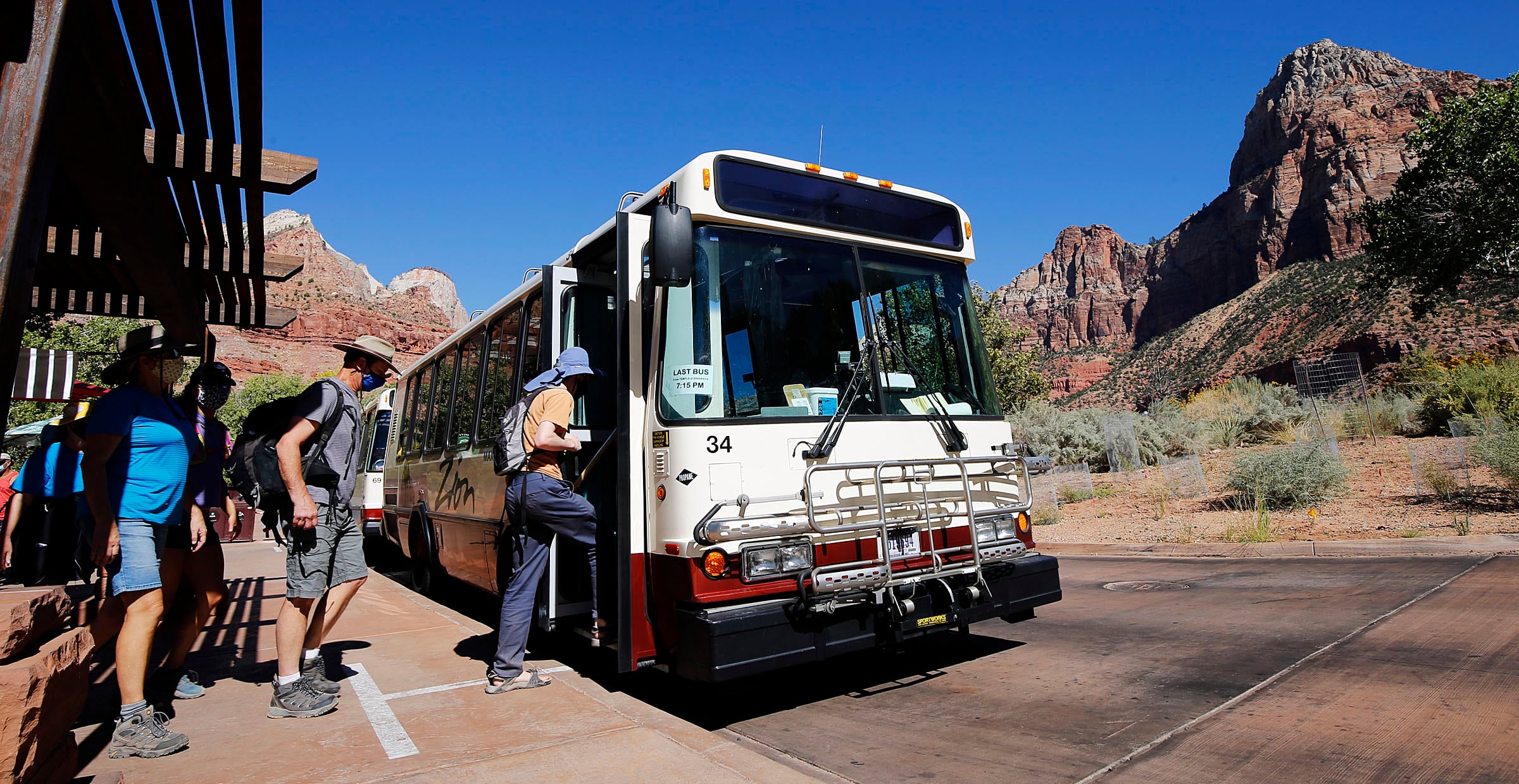 Visitors board a shuttle at Zion National Park on Oct. 14, 2020. Retired national park leaders on Friday urged the Department of the Interior to close all national parks if a government shutdown occurs.