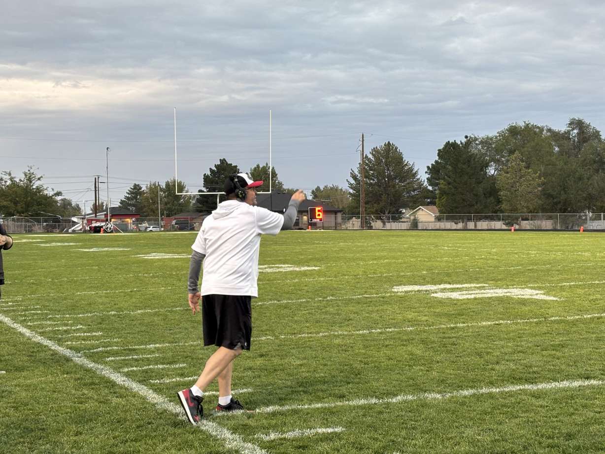 Alan Mouritsen coaching his team during a game.