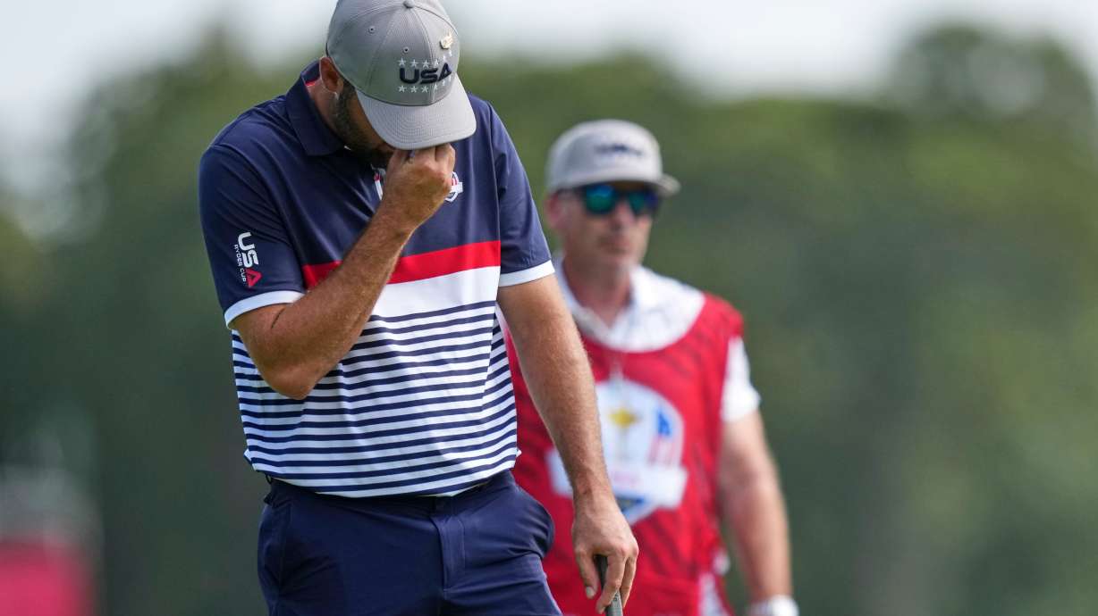 United States' Scottie Scheffler reacts after missing a putt on the 10th hole at Bethpage Black golf course during the Ryder Cup golf tournament, Friday, Sept. 26, 2025, in Farmingdale, N.Y.