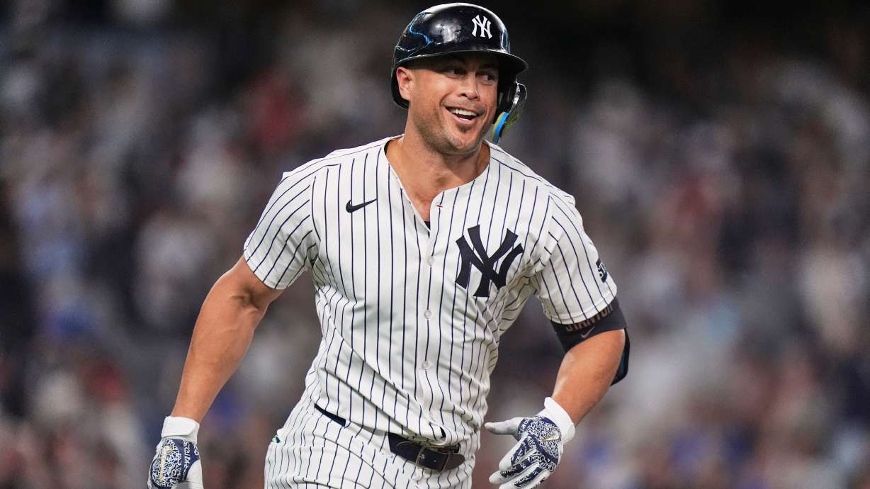 New York Yankees' Giancarlo Stanton smiles after hitting a two-run home run during the third inning of a baseball game against the Baltimore Orioles Friday, Sept. 26, 2025, in New York.