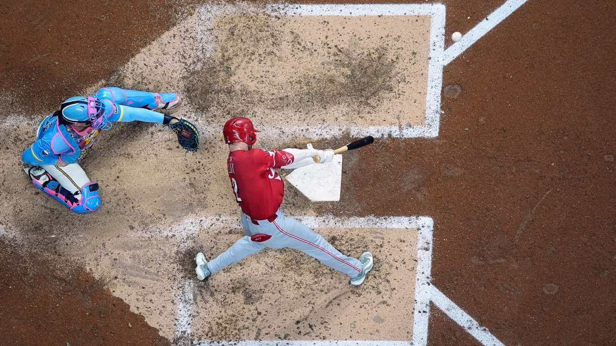 Cincinnati Reds' Gavin Lux hits a double during the sixth inning of a baseball game against the Milwaukee Brewers Friday, Sept. 26, 2025, in Milwaukee.