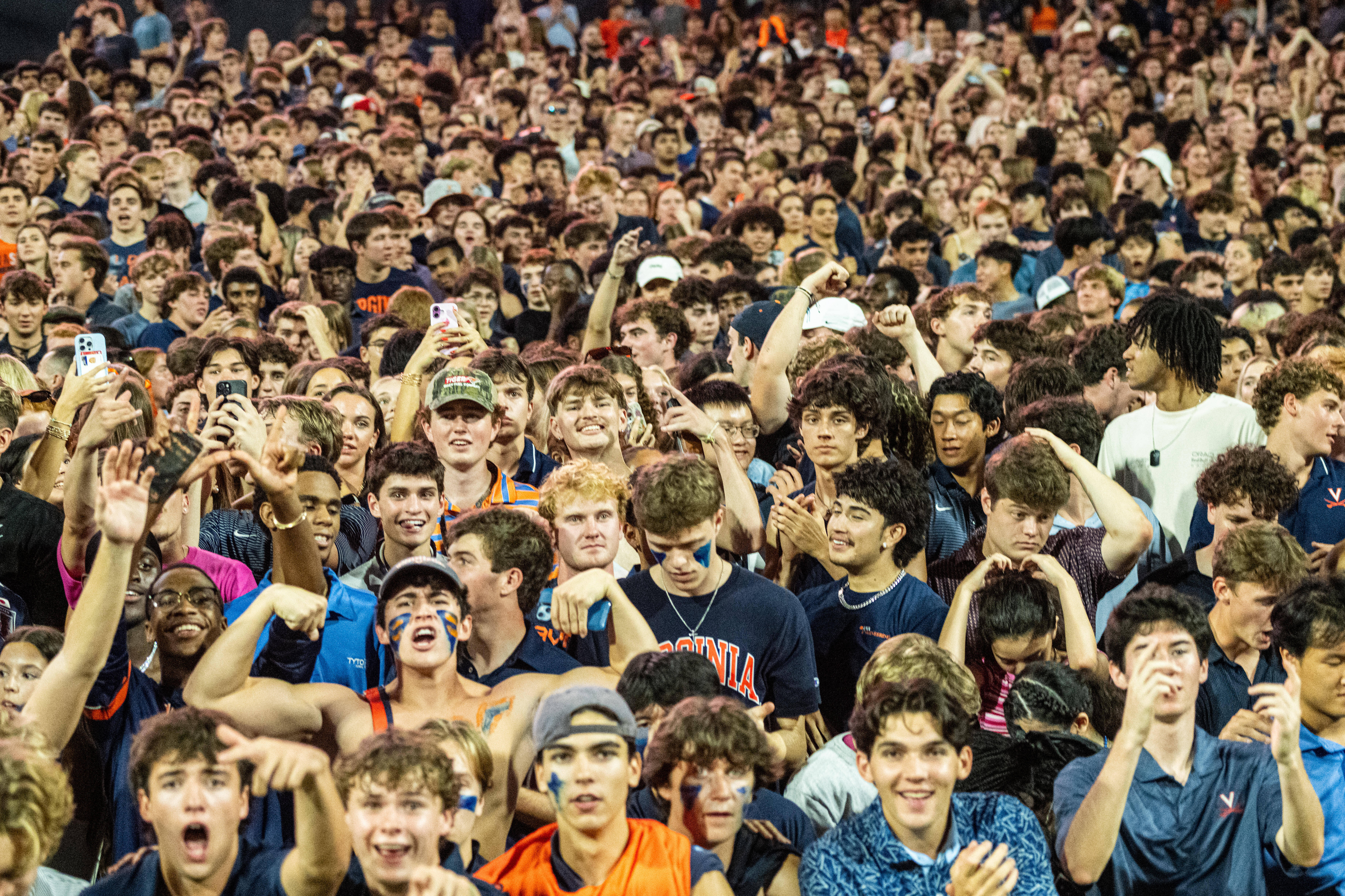 Virginia Fans take the field after overtime win over Florida State of an NCAA college football game, Friday, Sept. 26 2025, in Charlottesville, Va. 