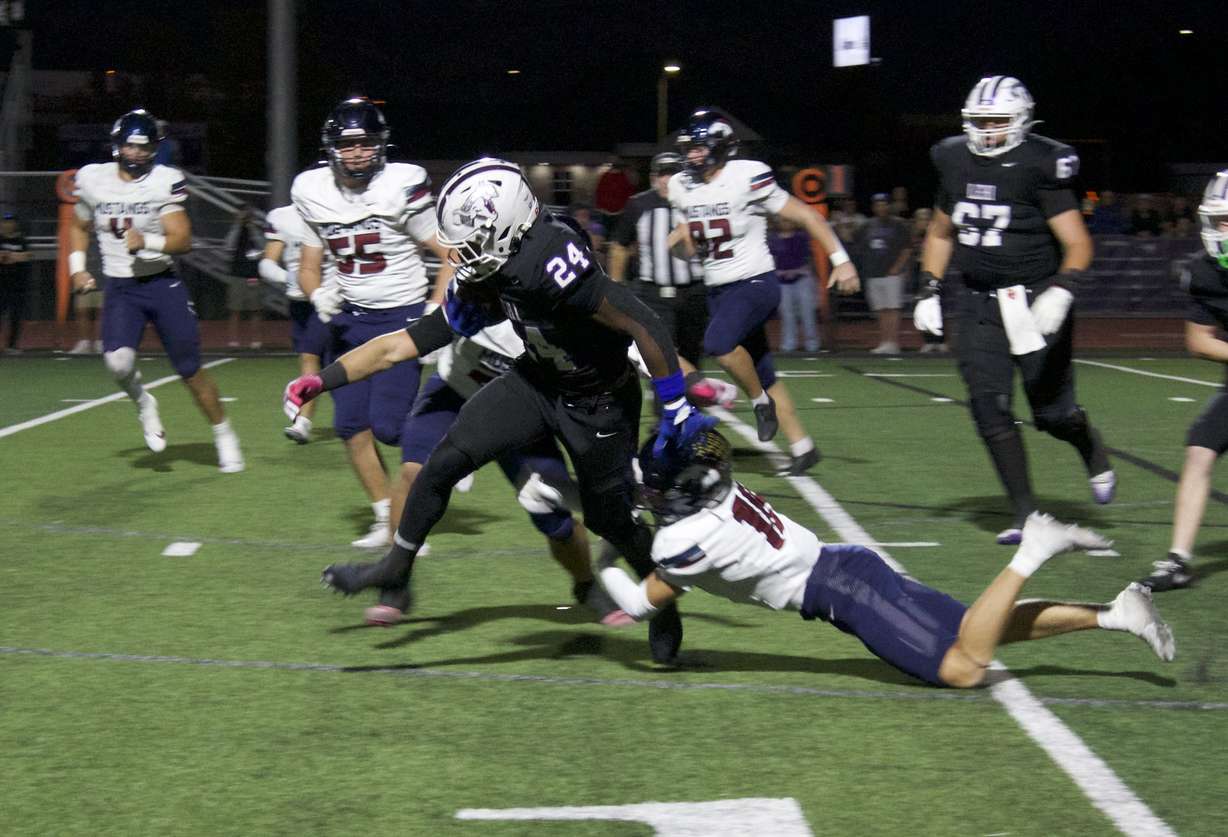 Lehi running back Devaughn Eka tries to run for more yards during a Utah high school football game against Herriman, Friday, Sept. 25, 2025 at Lehi High School.