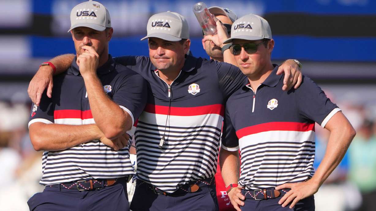 United States captain Keegan Bradley, middle, stands with Bryson DeChambeau and Ben Griffin on the 12th hole at Bethpage Black golf course during the Ryder Cup golf tournament, Friday, Sept. 26, 2025, in Farmingdale, N.Y.