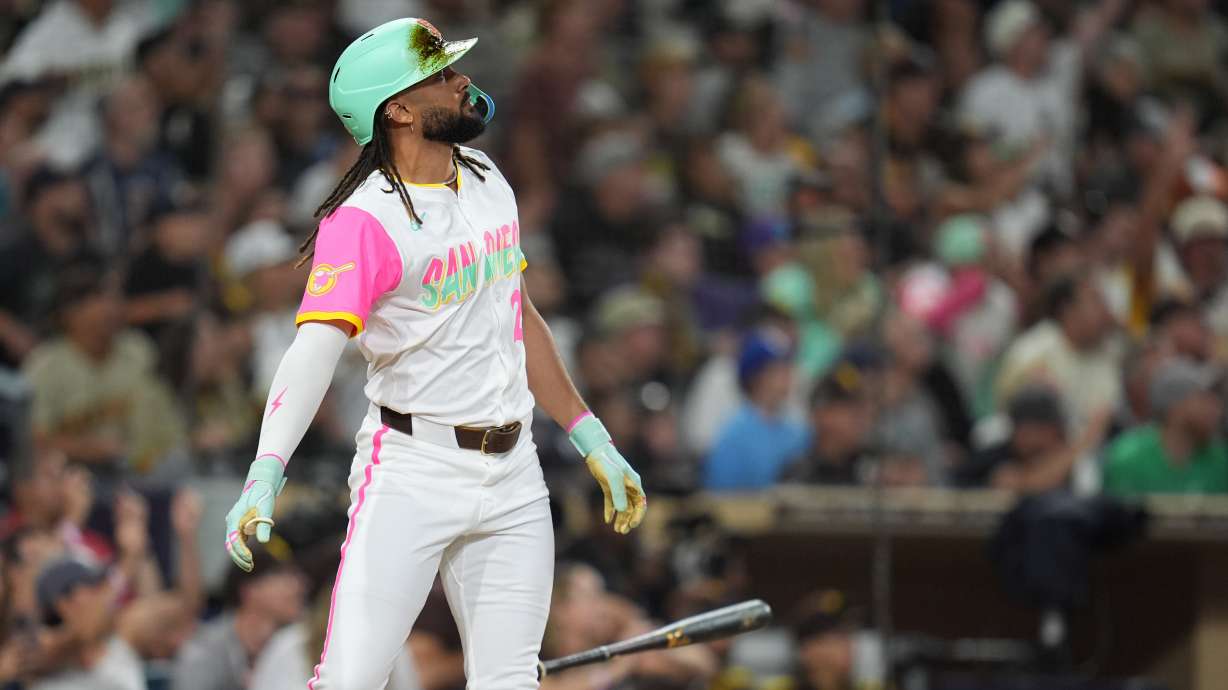 San Diego Padres' Fernando Tatis Jr. watches his grand slam during the fourth inning of a baseball game against the Arizona Diamondbacks Friday, Sept. 26, 2025, in San Diego.