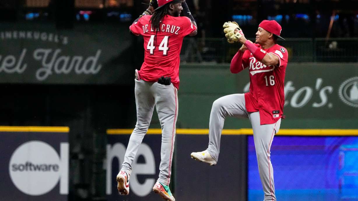 Cincinnati Reds' Elly De La Cruz and Noelvi Marte celebrate after a baseball game against the Milwaukee Brewers Friday, Sept. 26, 2025, in Milwaukee.