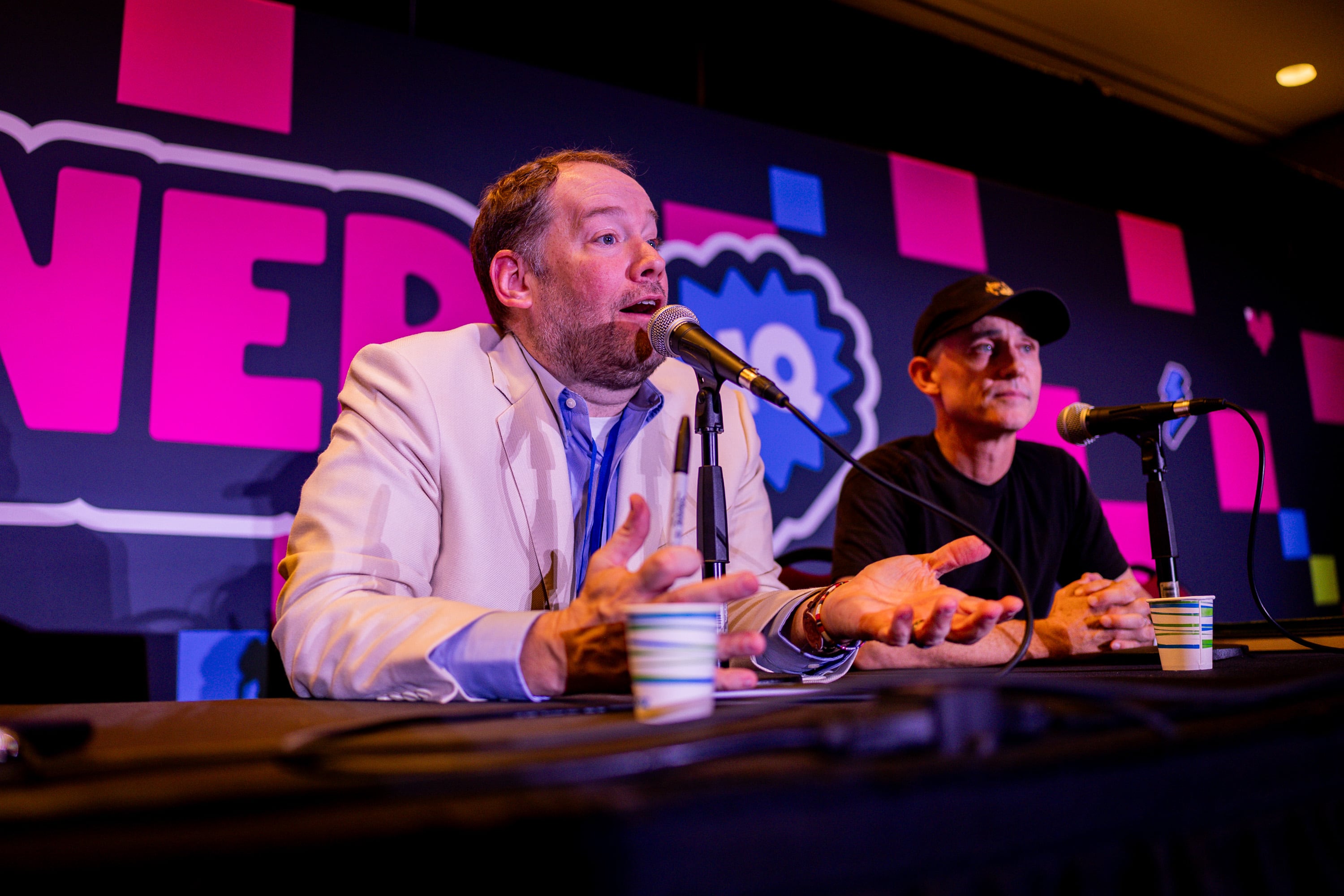 Director of the future movie adaptation of “Fablehaven,” Cameron Sawyer, right, sits with author Brandon Mull, left, as he speaks at FanX Salt Lake Pop Culture and Comic Convention at the Salt Palace Convention Center in Salt Lake City on Friday.