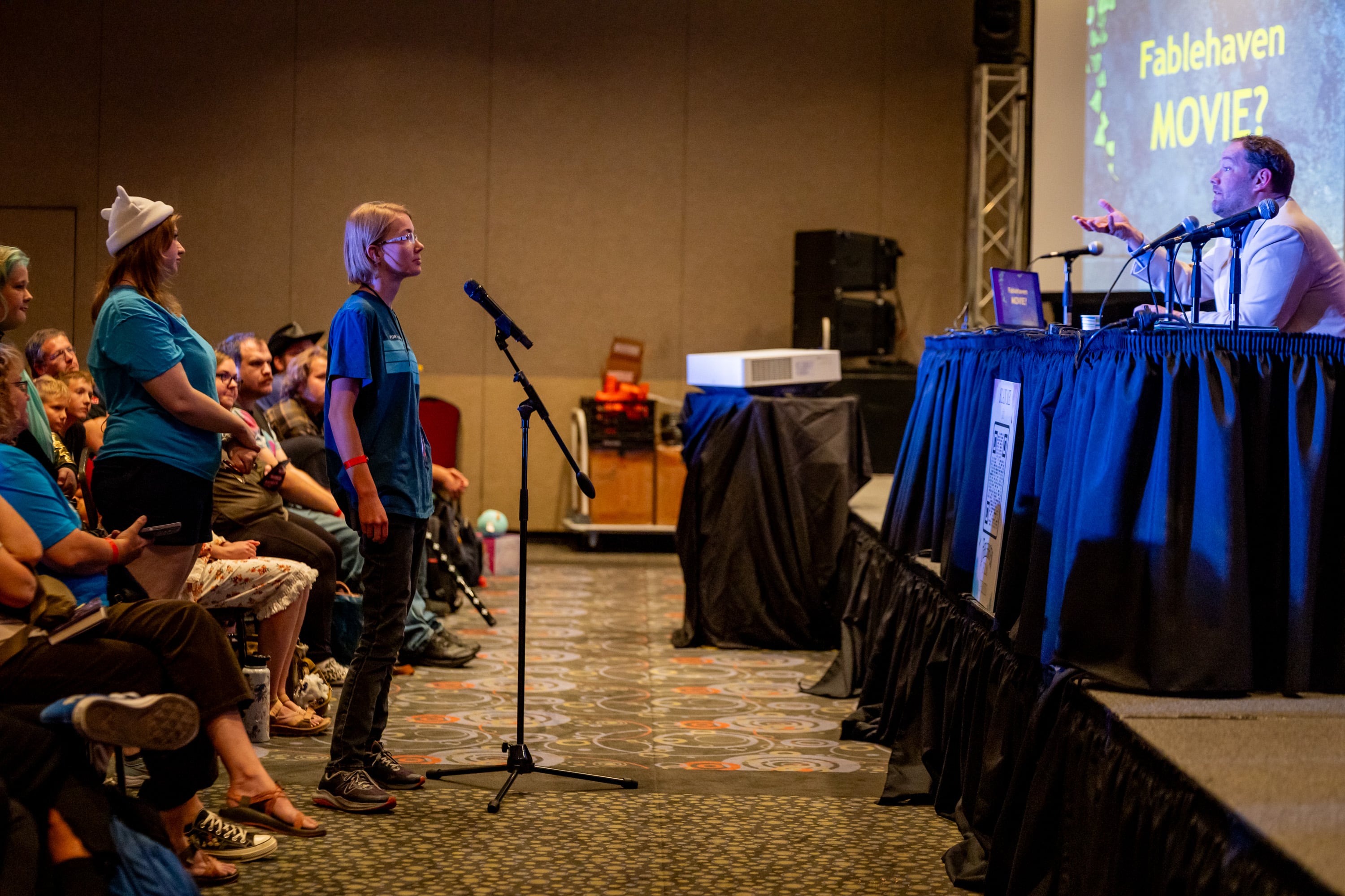 Aubrey Passey, from American Fork, left, asks author Brandon Mull, right, a question at FanX Salt Lake Pop Culture and Comic Convention at the Salt Palace Convention Center in Salt Lake City on Friday.