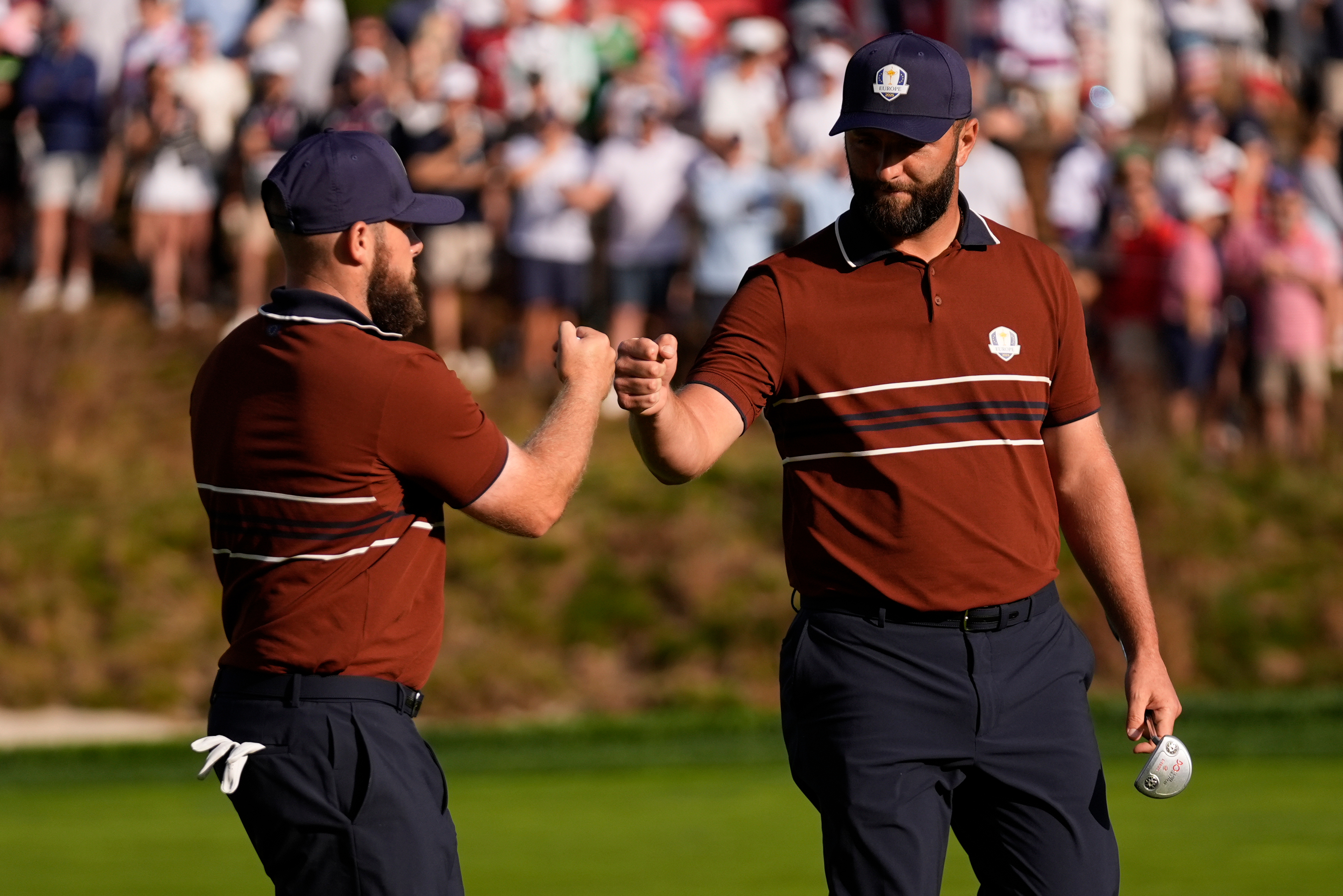 Europe's Tyrrell Hatton celebrates with Jon Rahm on the sixth hole at Bethpage Black golf course during the Ryder Cup golf tournament, Saturday, Sept. 27, 2025, in Farmingdale, N.Y. 